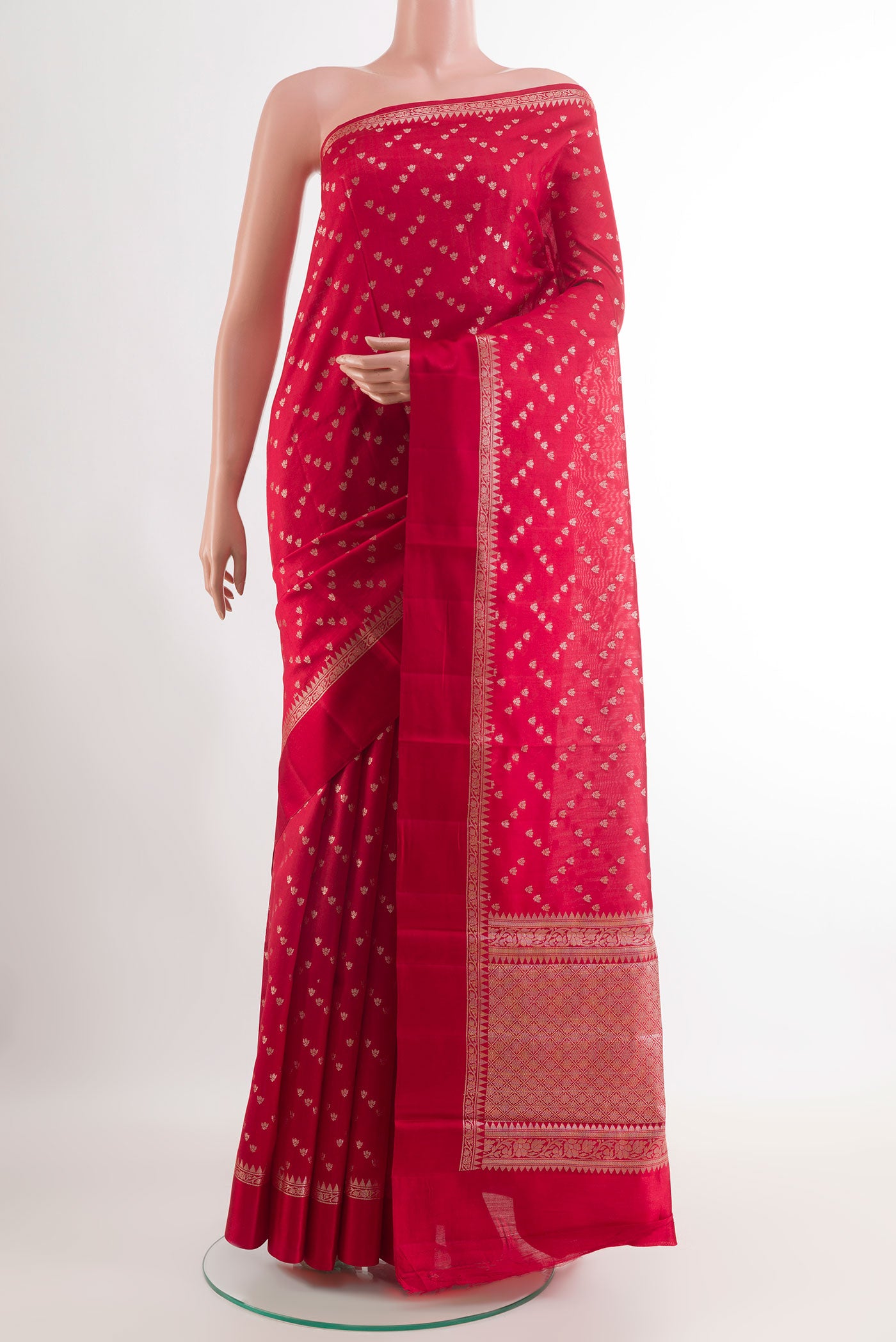Red Tussar Silk Saree with Zari Butta on the body and Zari Border.  displayed on a mannequin