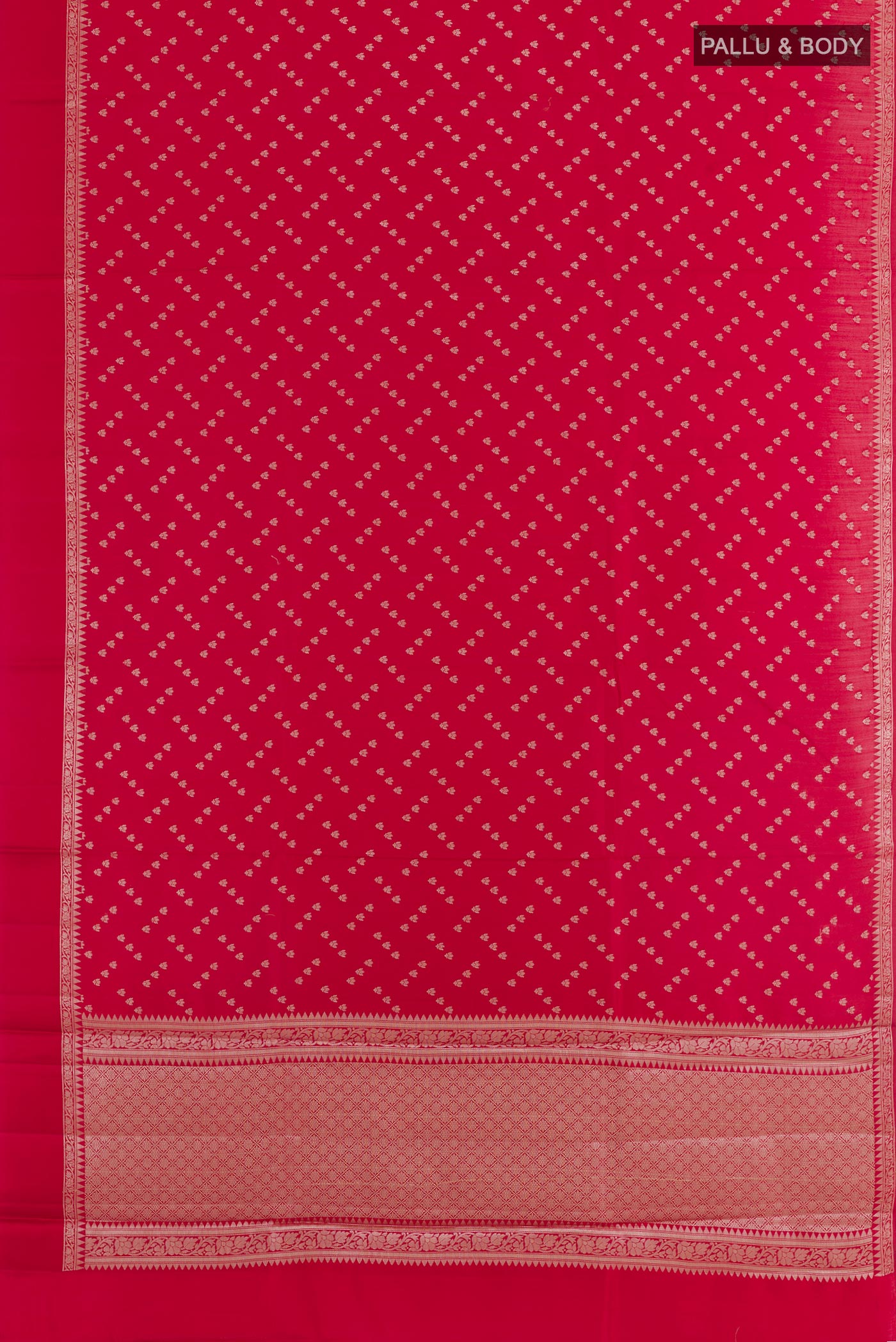 Flat view of Red Tussar Silk Saree with Zari Butta on the body and Zari Border. 