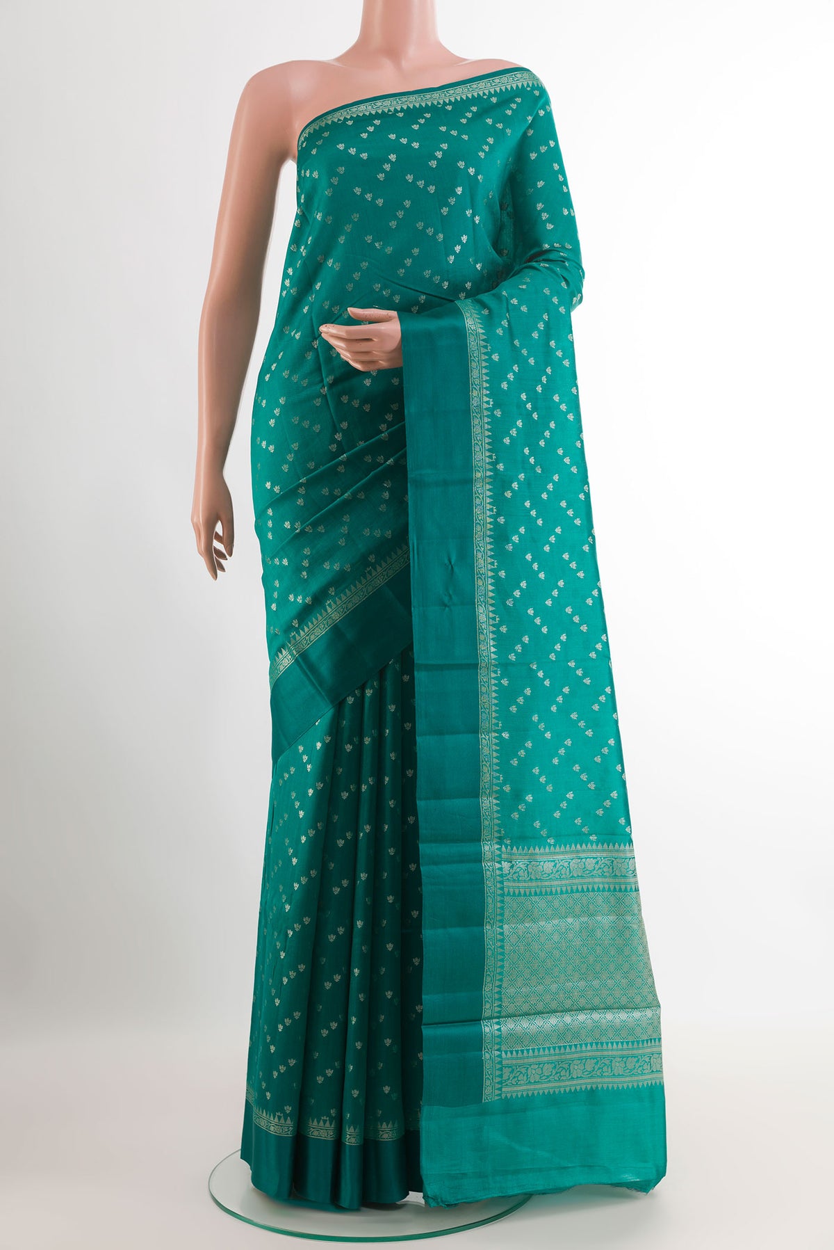 Sea Green Tussar Silk Saree with Zari Butta on the body and Zari Border.  displayed on a mannequin