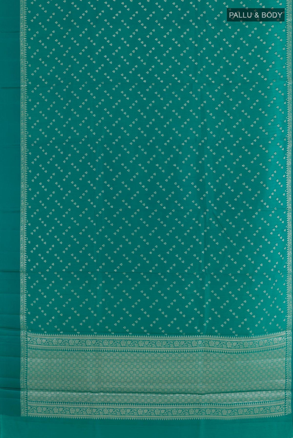 Flat view of Sea Green Tussar Silk Saree with Zari Butta on the body and Zari Border. 