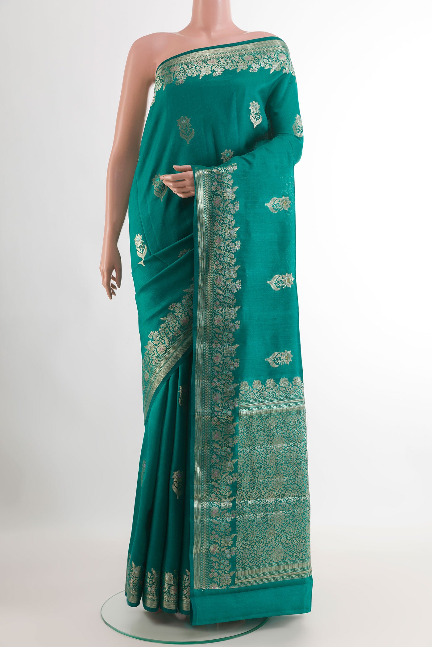 Sea Green Tussar Silk Saree with Zari Butta on the body and Zari Border.  displayed on a mannequin