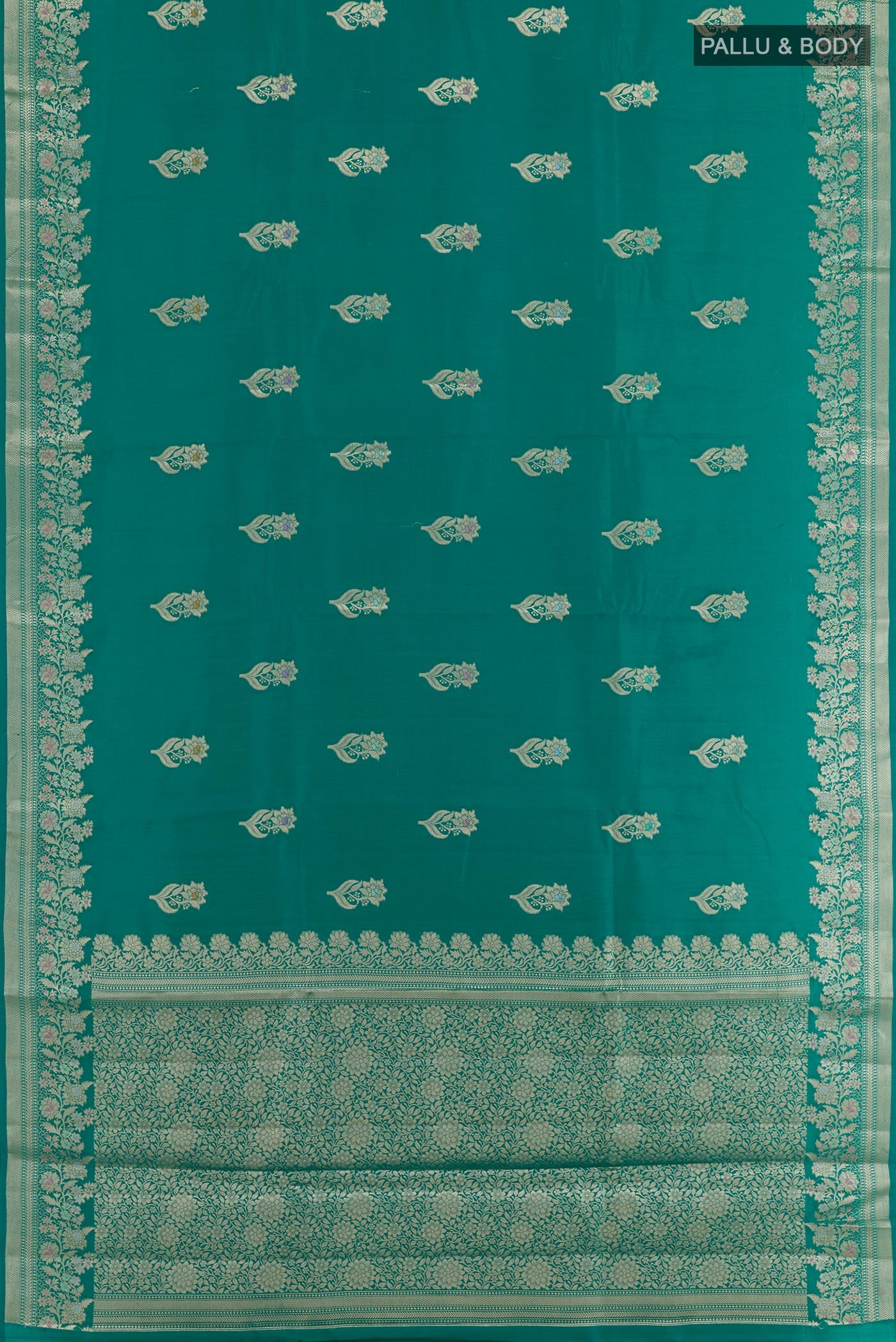 Flat view of Sea Green Tussar Silk Saree with Zari Butta on the body and Zari Border. 