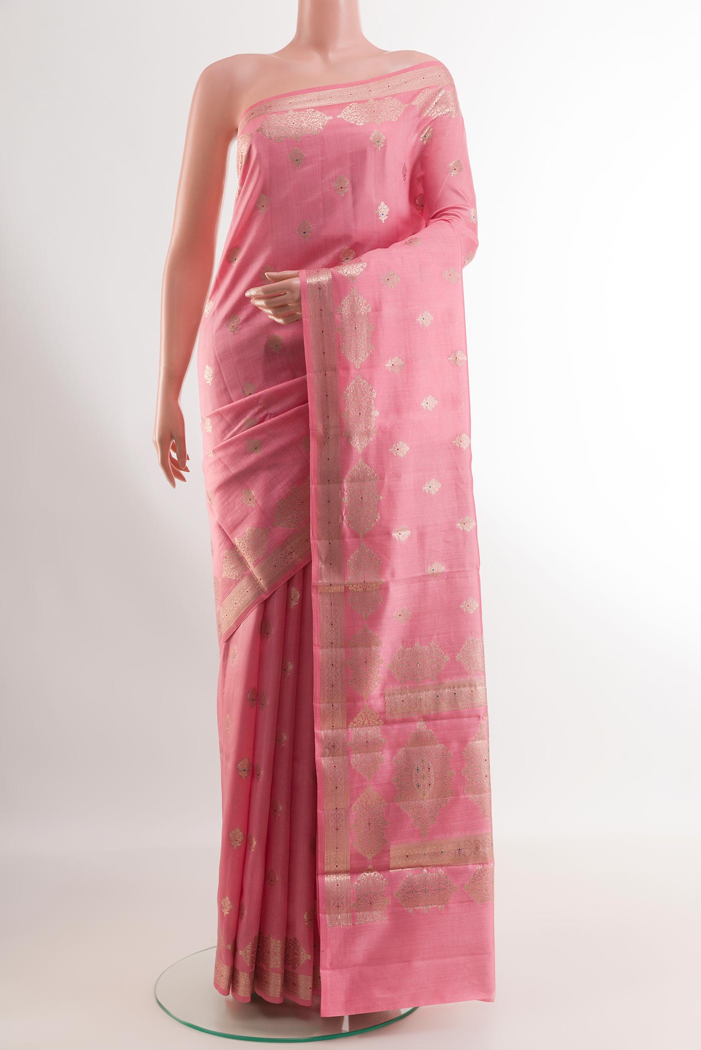 Pink Tussar Silk Saree with Zari Butta on the body and Zari Border.  displayed on a mannequin