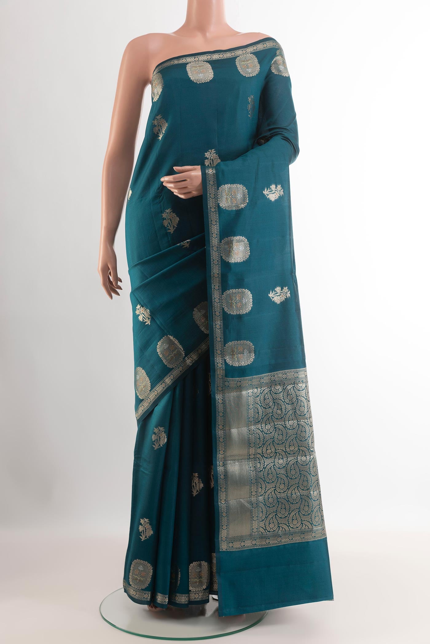 Royal Blue Tussar Silk Saree with Zari Butta on the body and Zari Border.  displayed on a mannequin