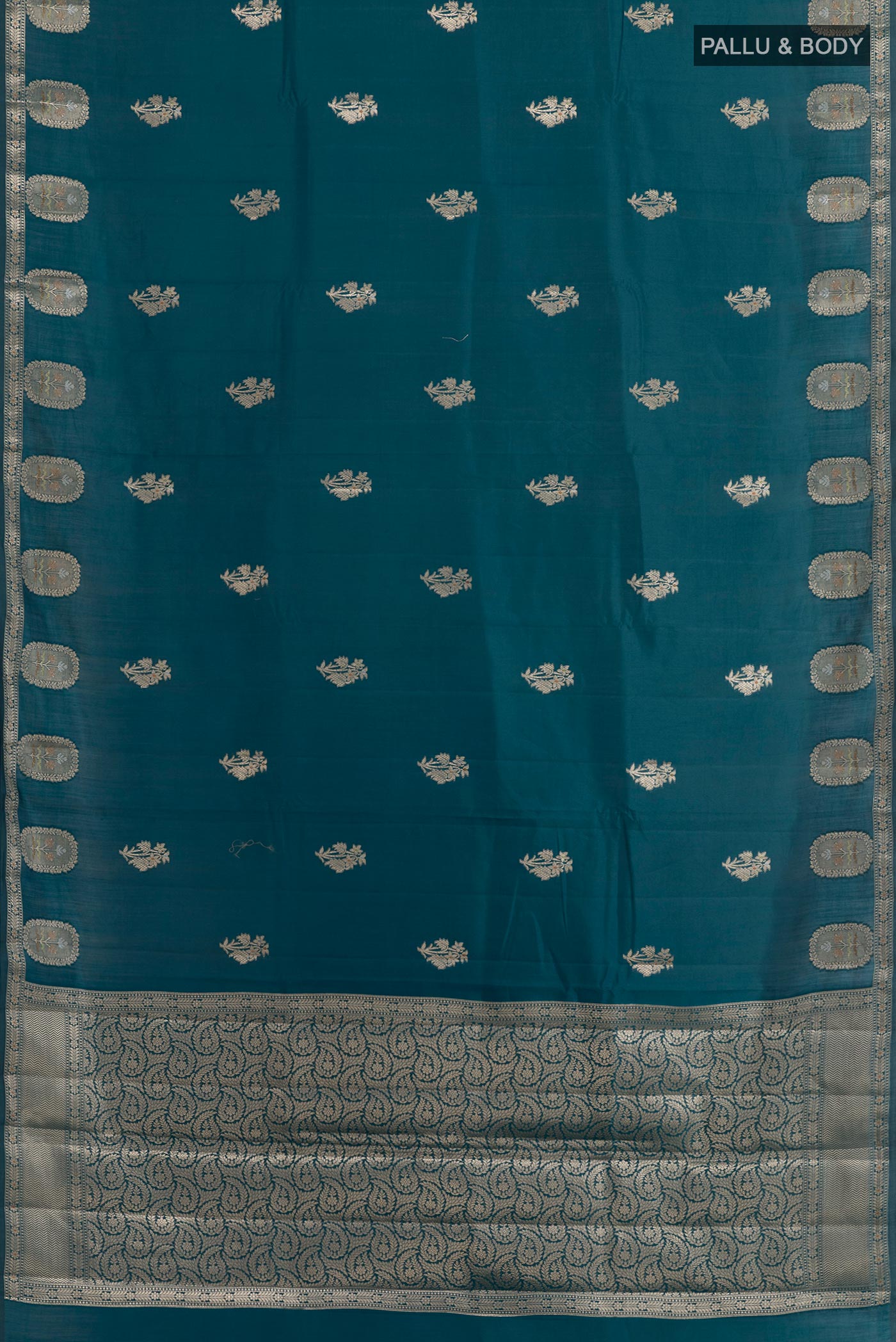 Flat view of Royal Blue Tussar Silk Saree with Zari Butta on the body and Zari Border. 