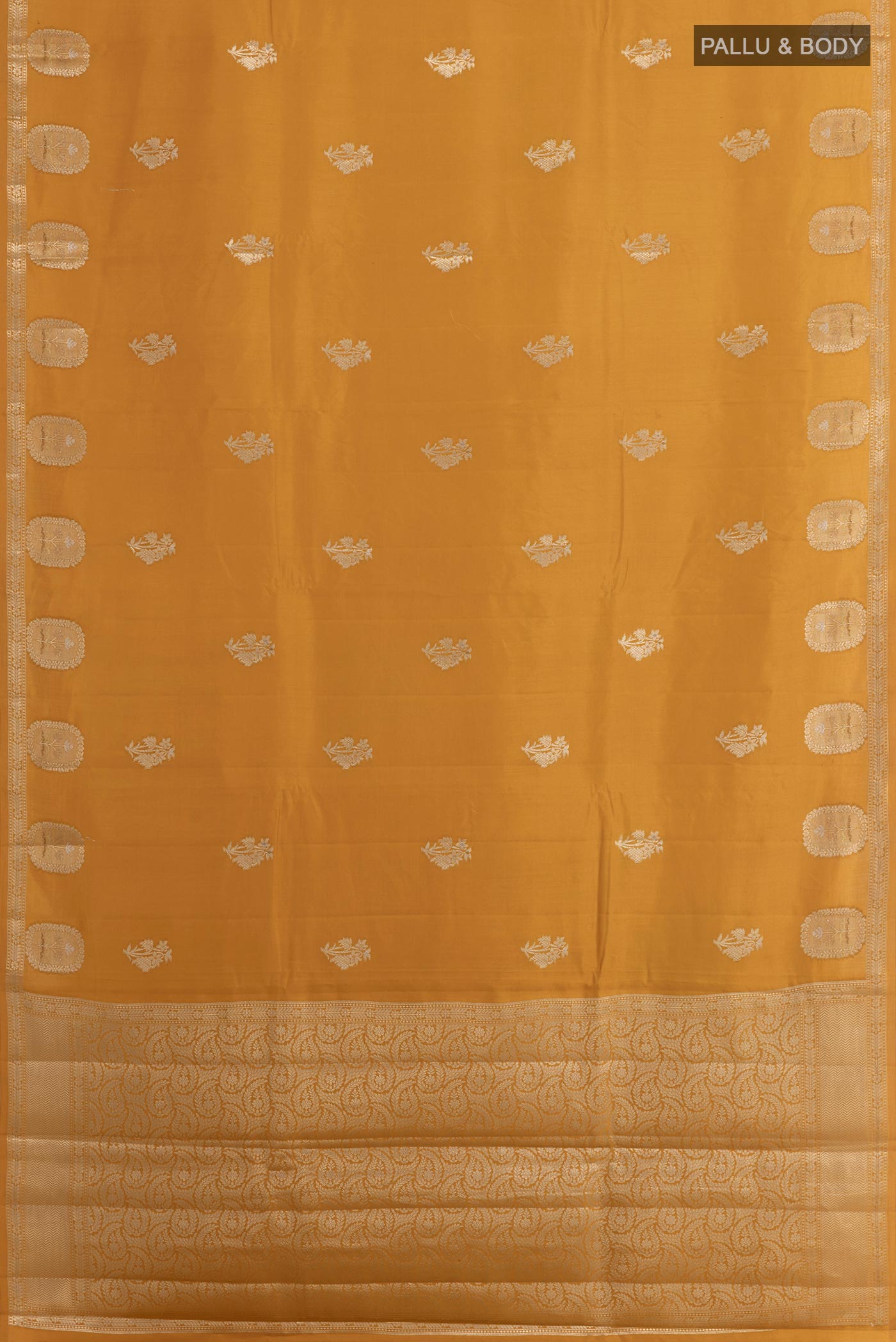 Flat view of Yellow Tussar Silk Saree with Zari Butta on the body and Zari Border. 