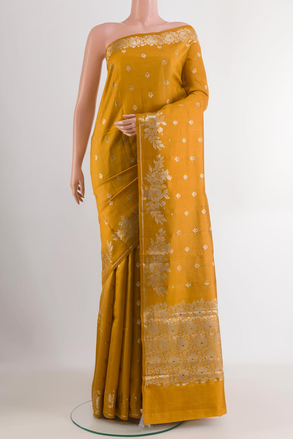 Yellow Tussar Silk Saree with Zari Butta on the body and Zari Border.  displayed on a mannequin