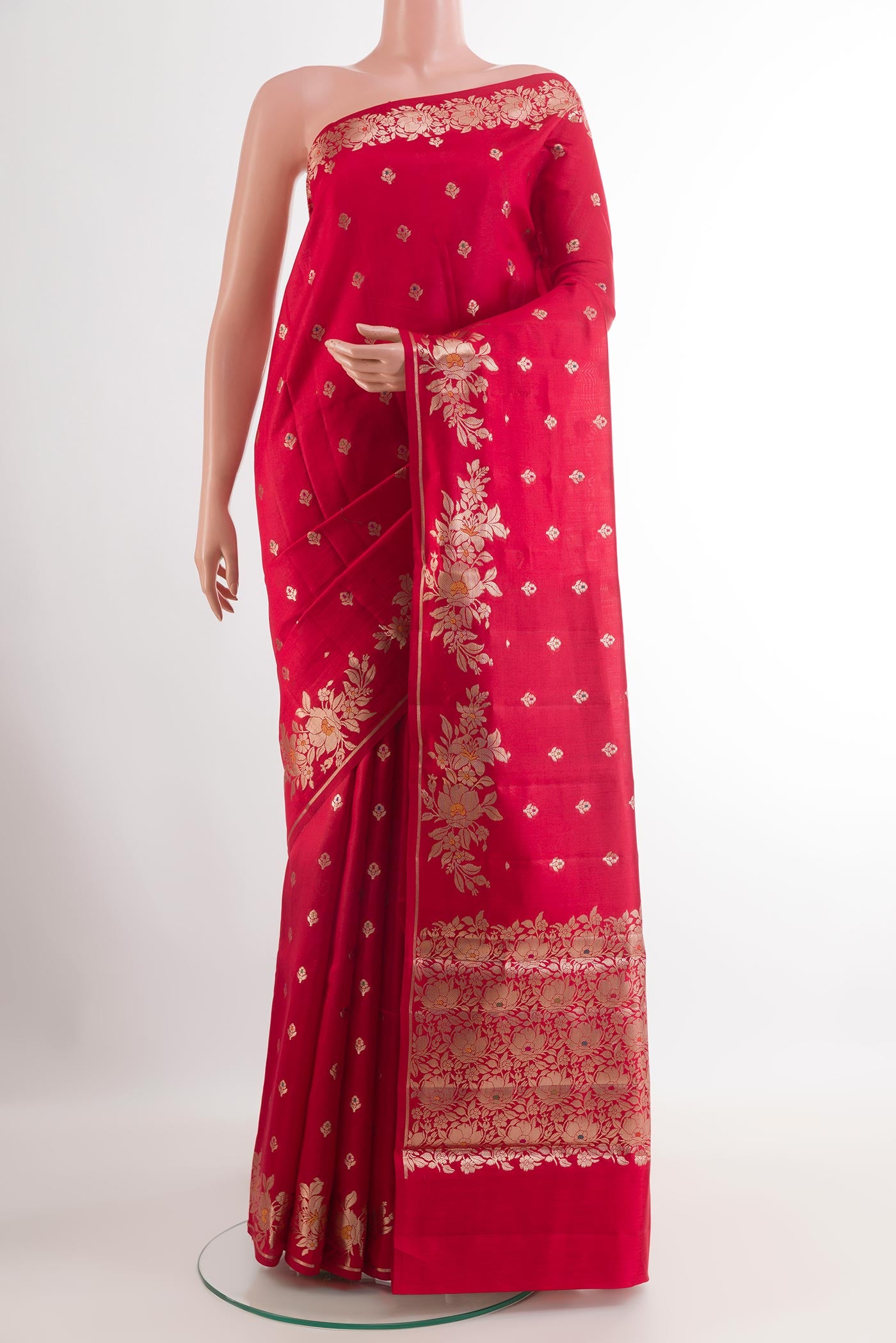 Red Tussar Silk Saree with Zari Butta on the body and Zari Border.  displayed on a mannequin