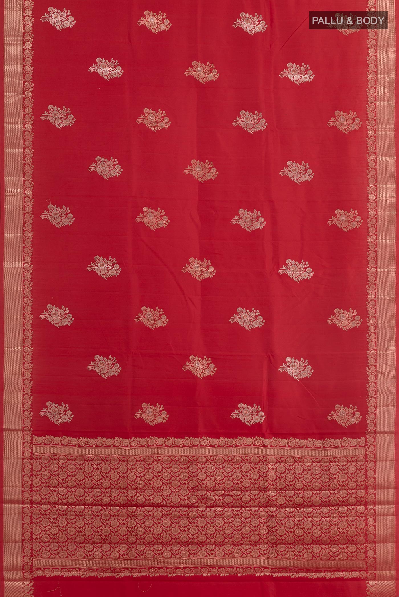 Flat view of Red Tussar Silk Saree with Zari Butta on the body and Zari Border. 