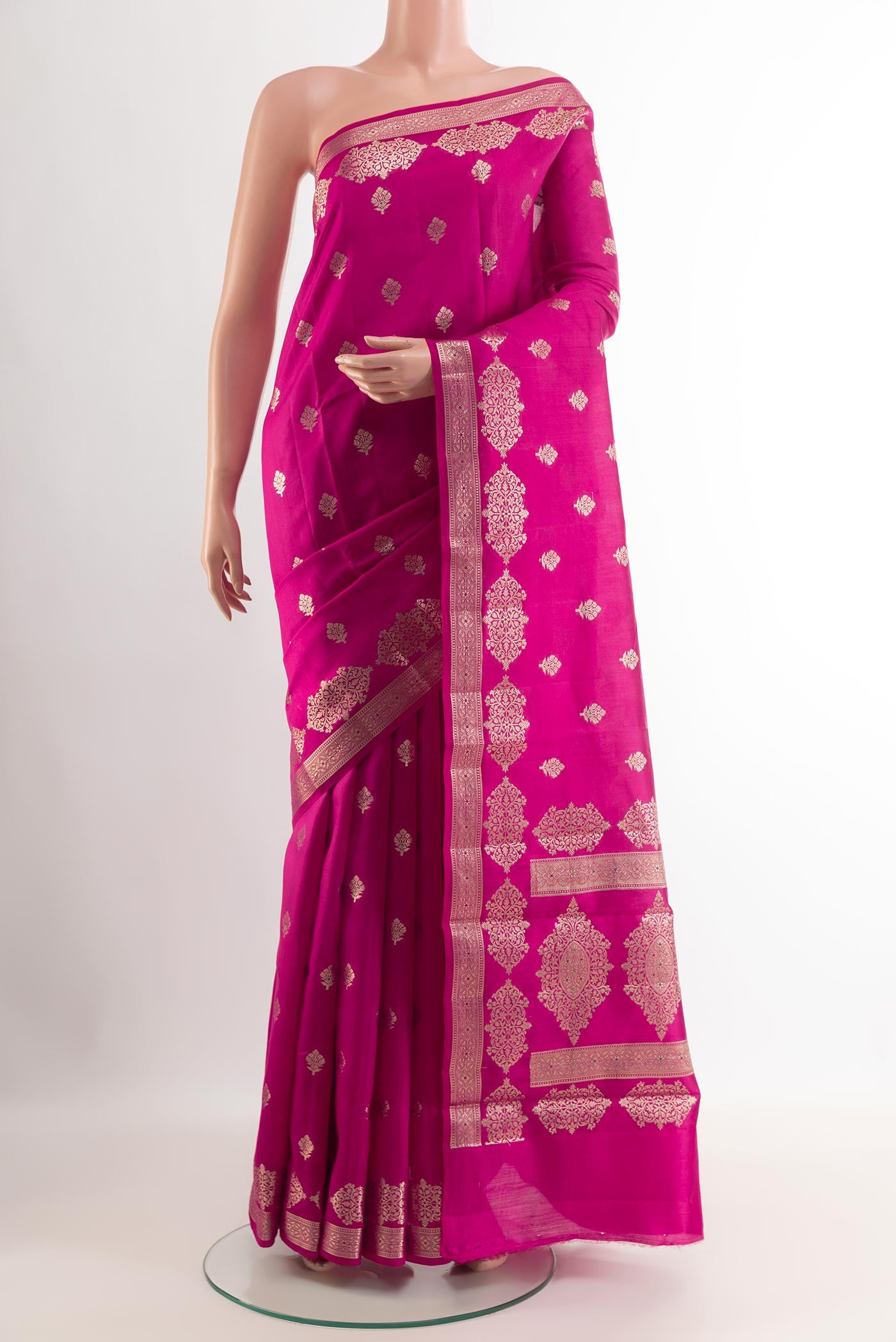 Pink Tussar Silk Saree with Zari Butta on the body and Zari Border.  displayed on a mannequin