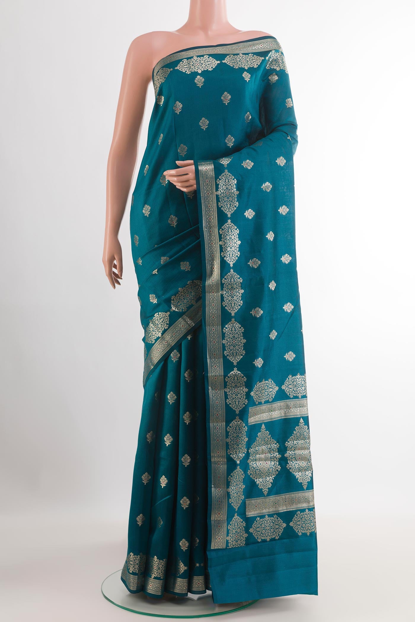 Blue Tussar Silk Saree with Zari Butta on the body and Zari Border.  displayed on a mannequin