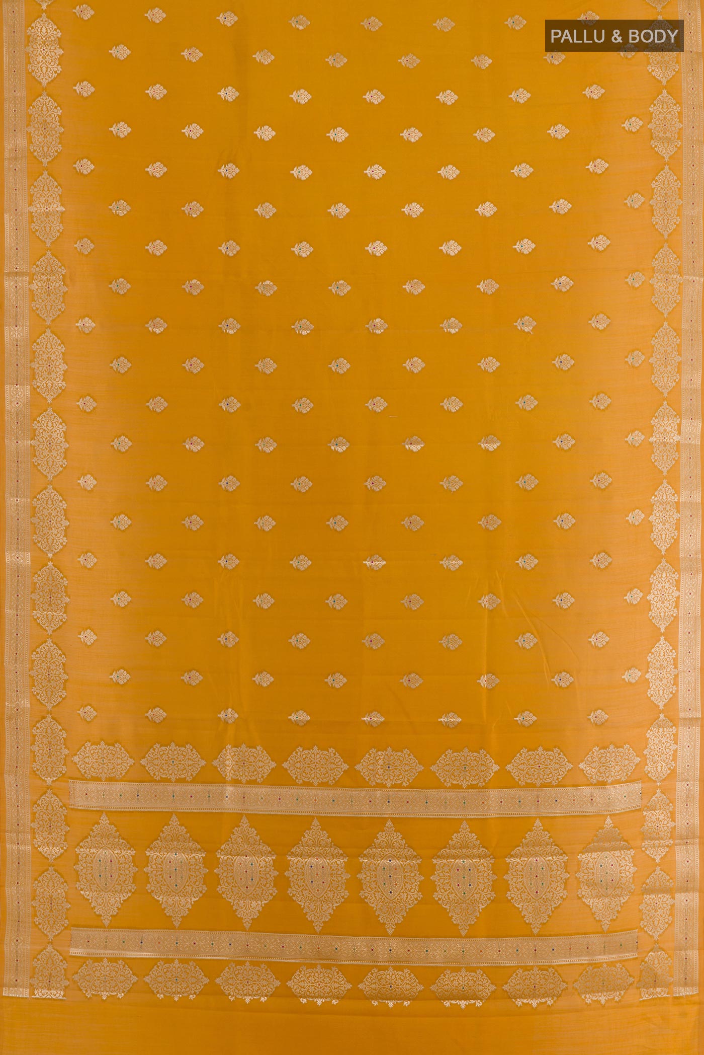 Flat view of Yellow Tussar Silk Saree with Zari Butta on the body and Zari Border. 