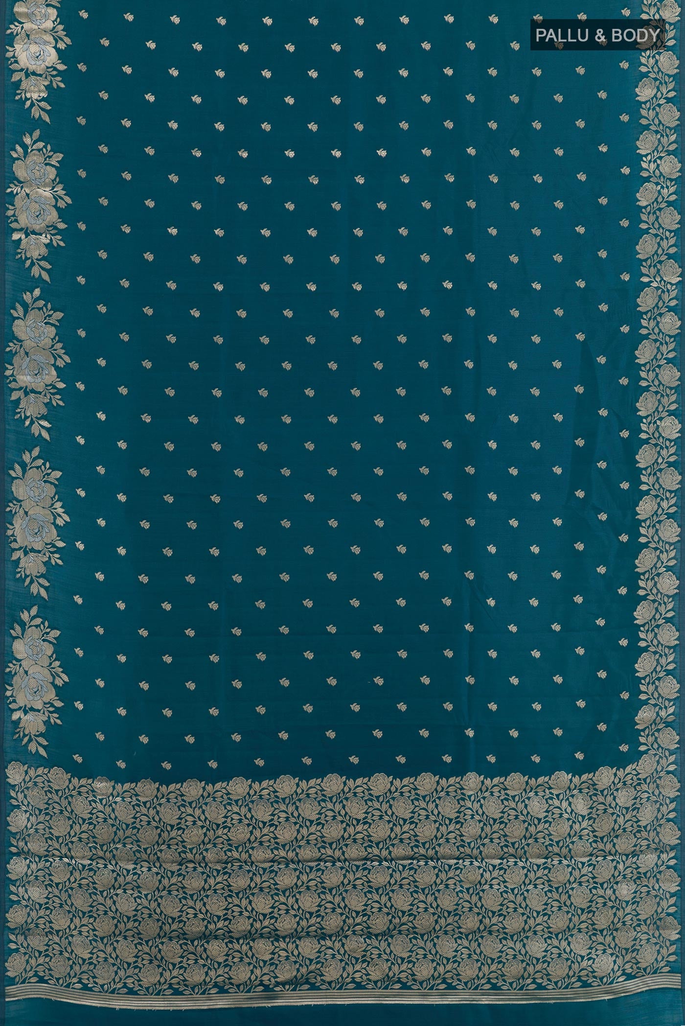 Flat view of Blue Tussar Silk Saree with Zari Butta on the body and Zari Border. 