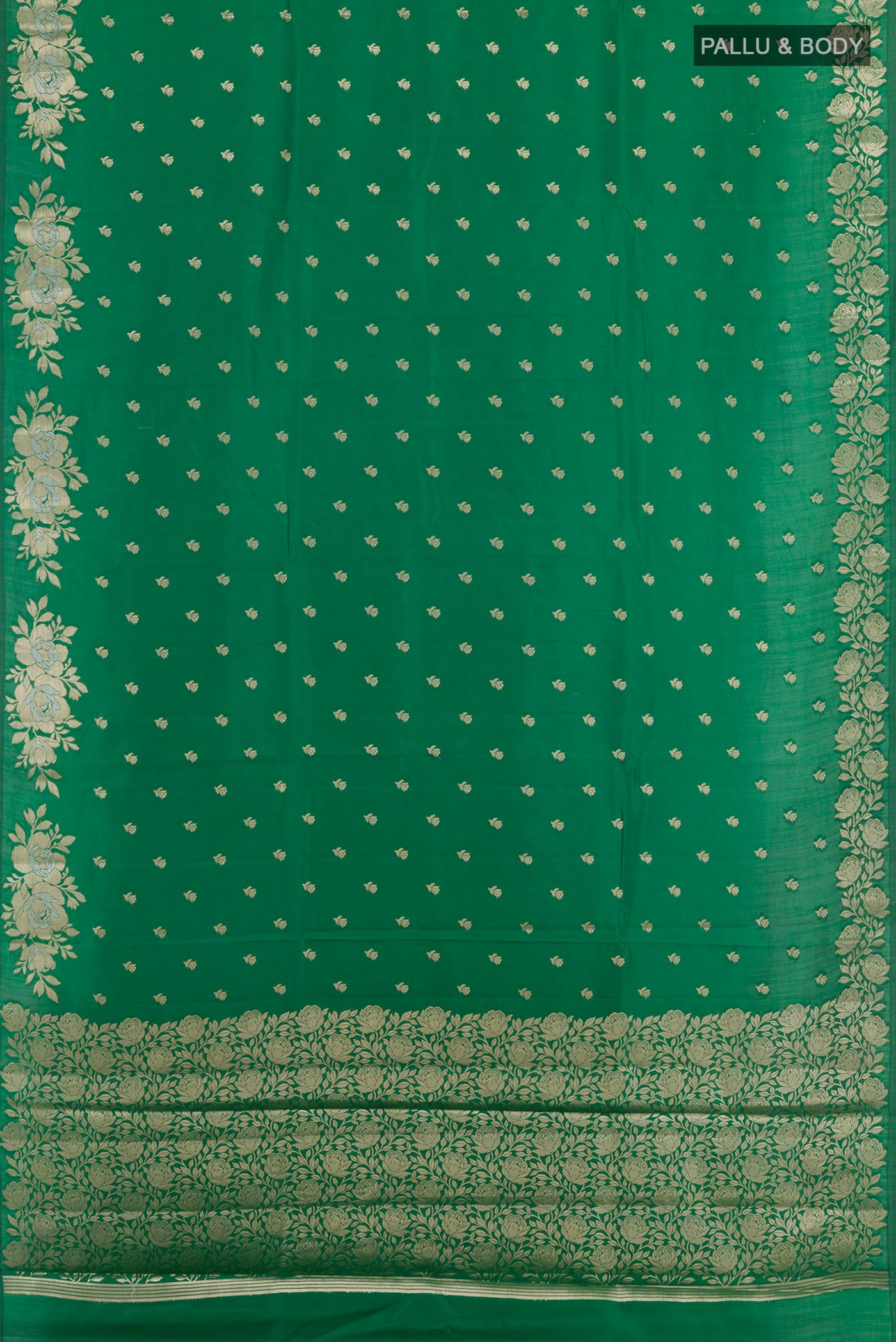 Flat view of Green Tussar Silk Saree with Zari Butta on the body and Zari Border. 