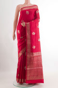 Red Tussar Silk Saree with Zari Butta on the body and Zari Border.  displayed on a mannequin