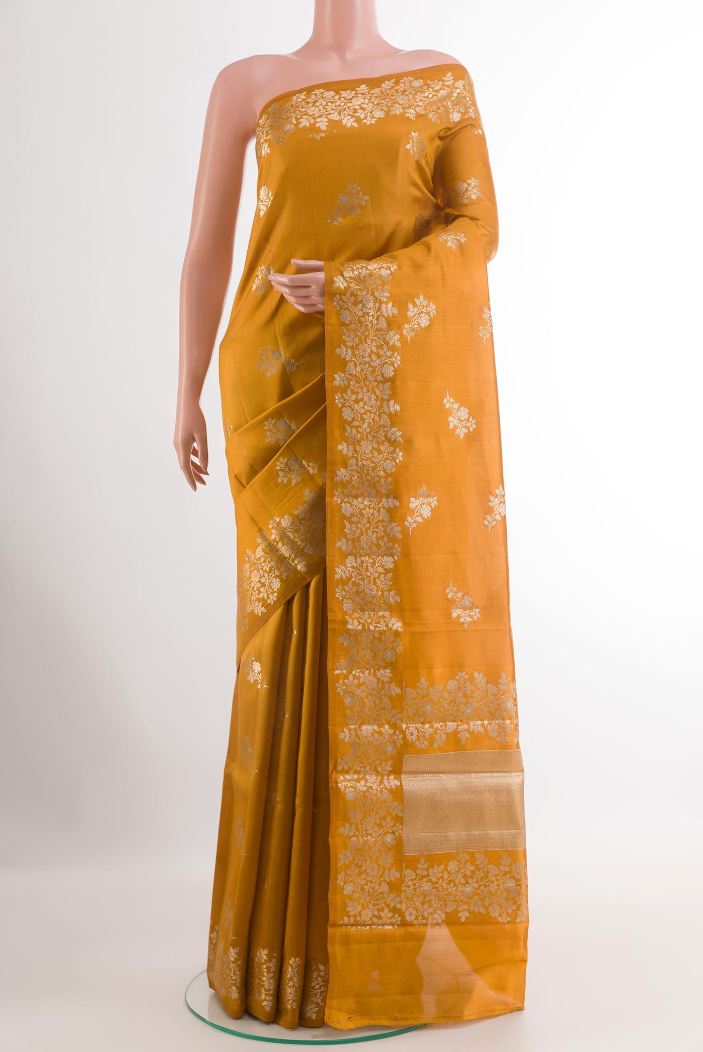Yellow Tussar Silk Saree with Zari Butta on the body and Zari Border.  displayed on a mannequin