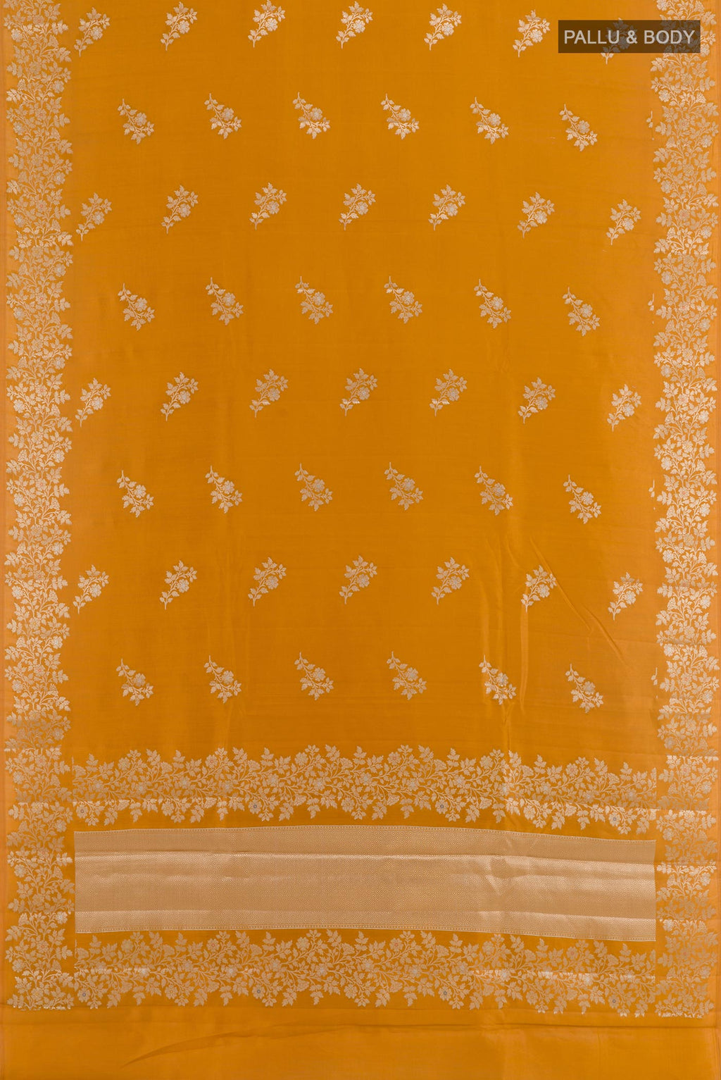 Flat view of Yellow Tussar Silk Saree with Zari Butta on the body and Zari Border. 