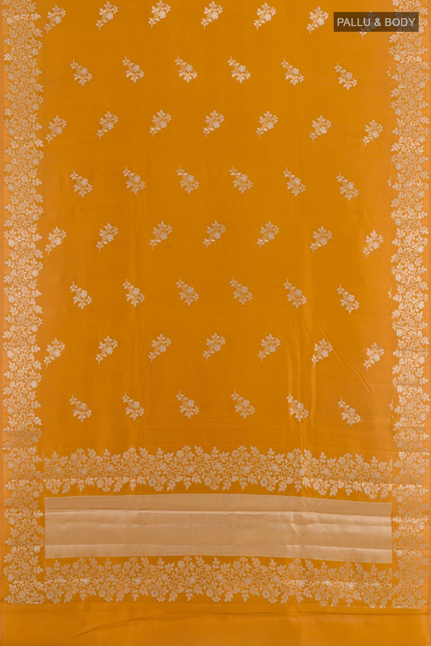 Flat view of Yellow Tussar Silk Saree with Zari Butta on the body and Zari Border. 