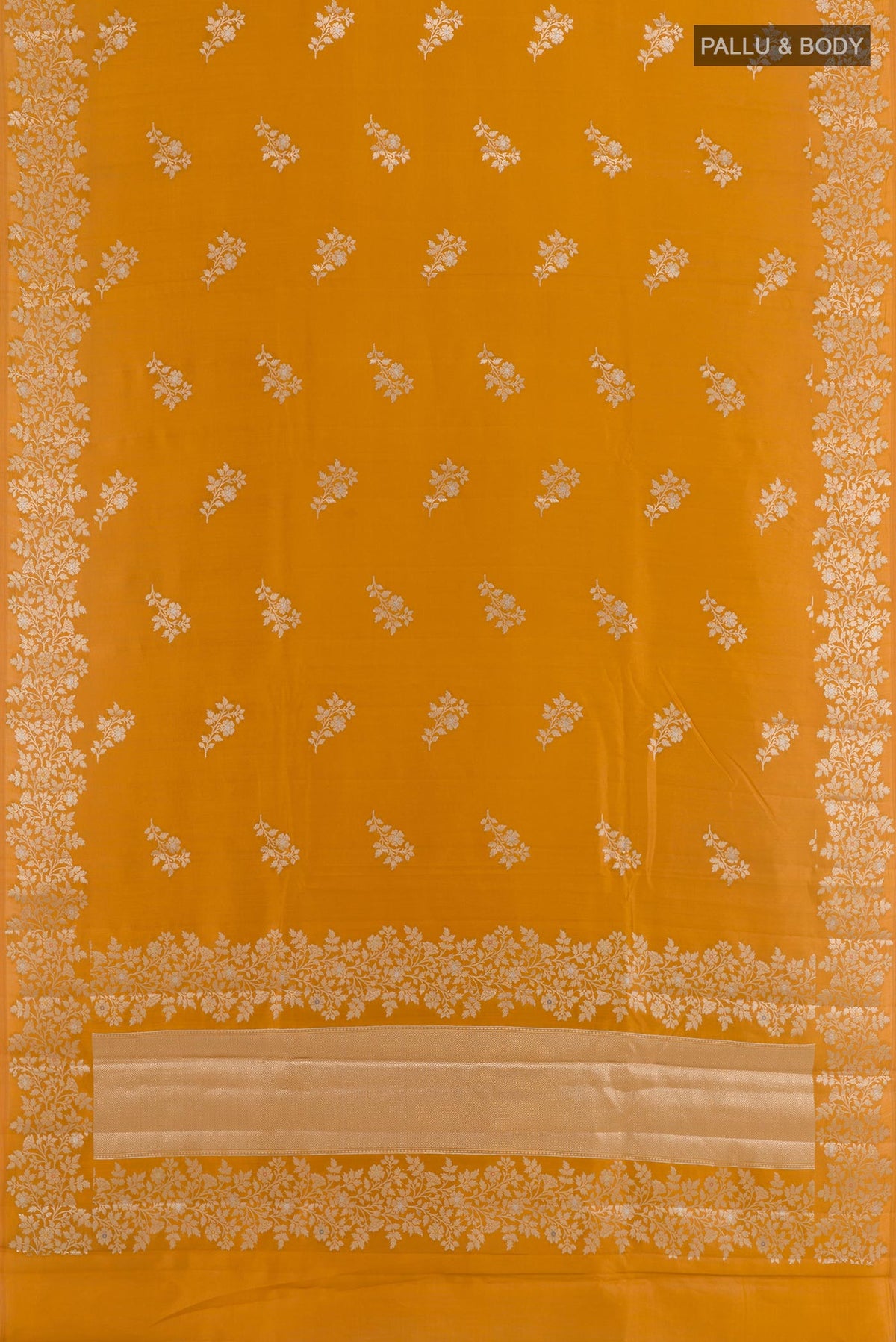 Flat view of Yellow Tussar Silk Saree with Zari Butta on the body and Zari Border. 