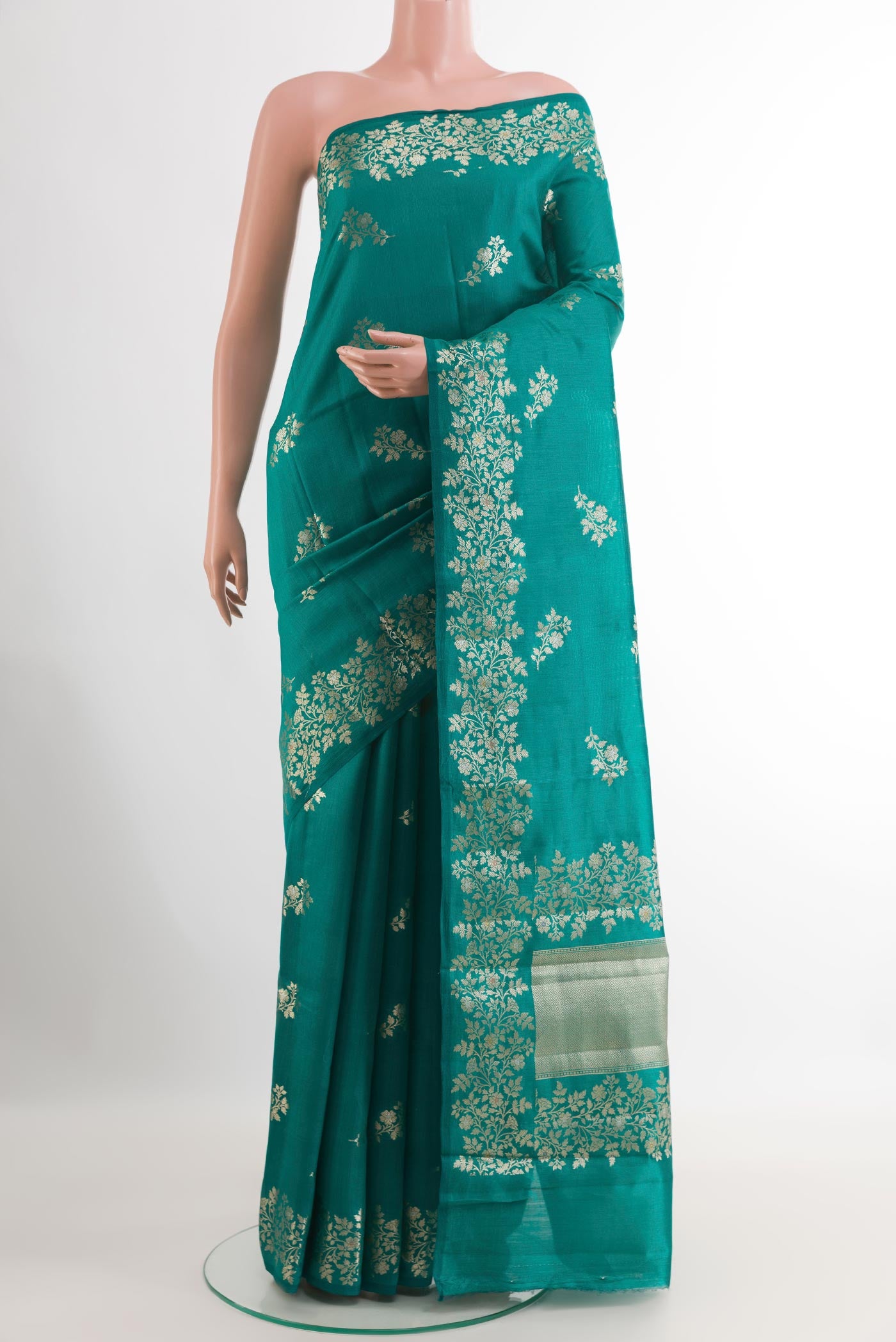 Sea Green Tussar Silk Saree with Zari Butta on the body and Zari Border.  displayed on a mannequin