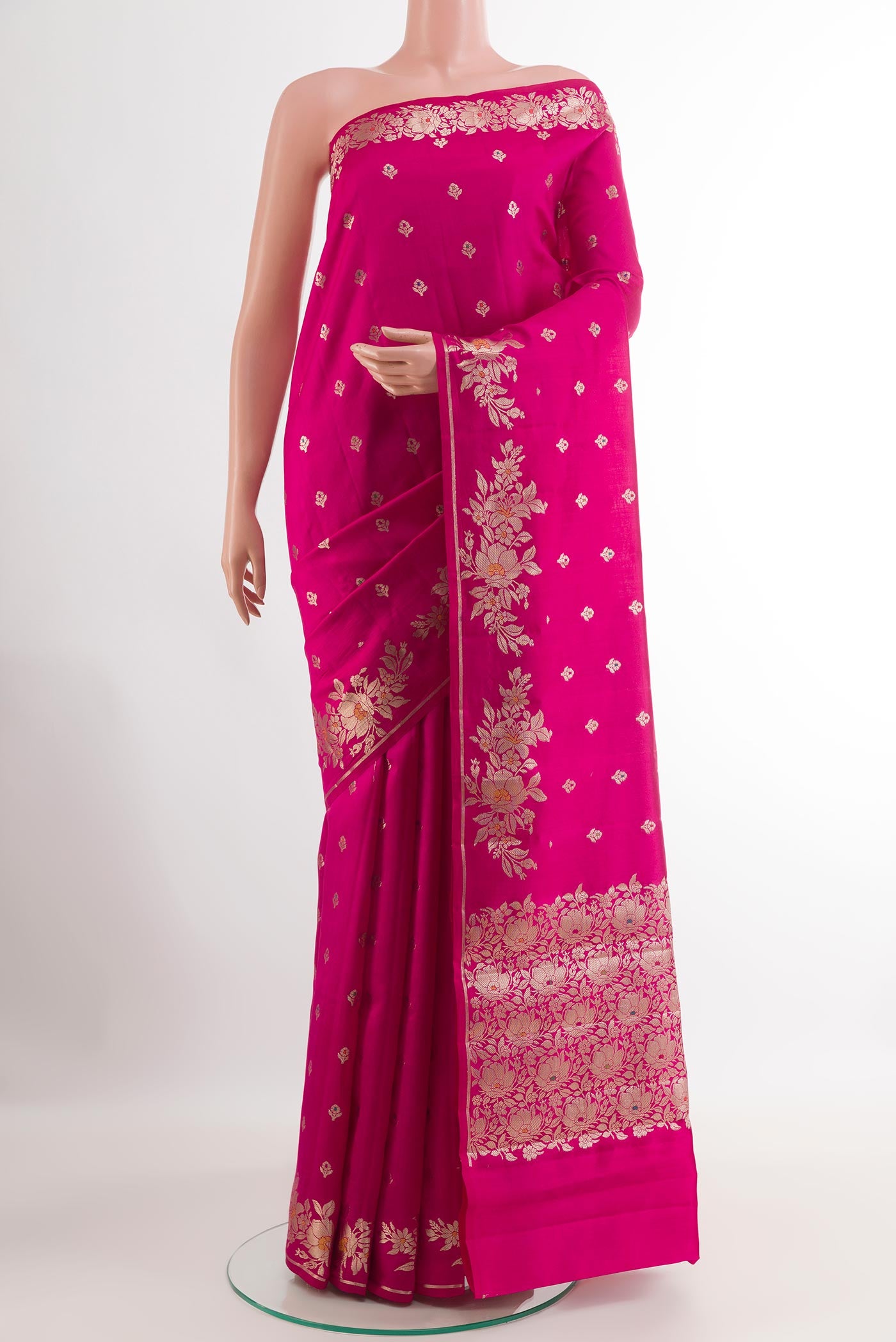Pink Tussar Silk Saree with Zari Butta on the body and Zari Border.  displayed on a mannequin