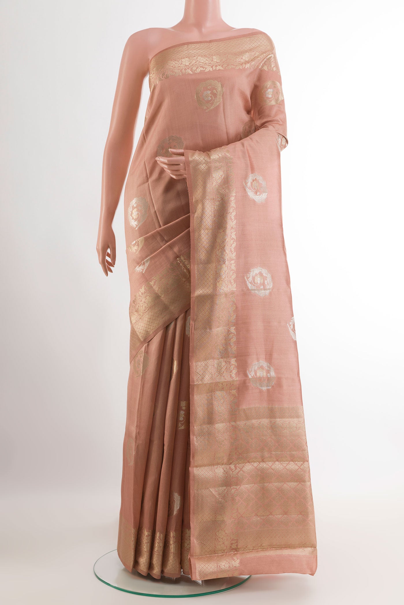 Imperial Pink Tussar Silk Saree with Zari Butta on the body and Zari Border.  displayed on a mannequin