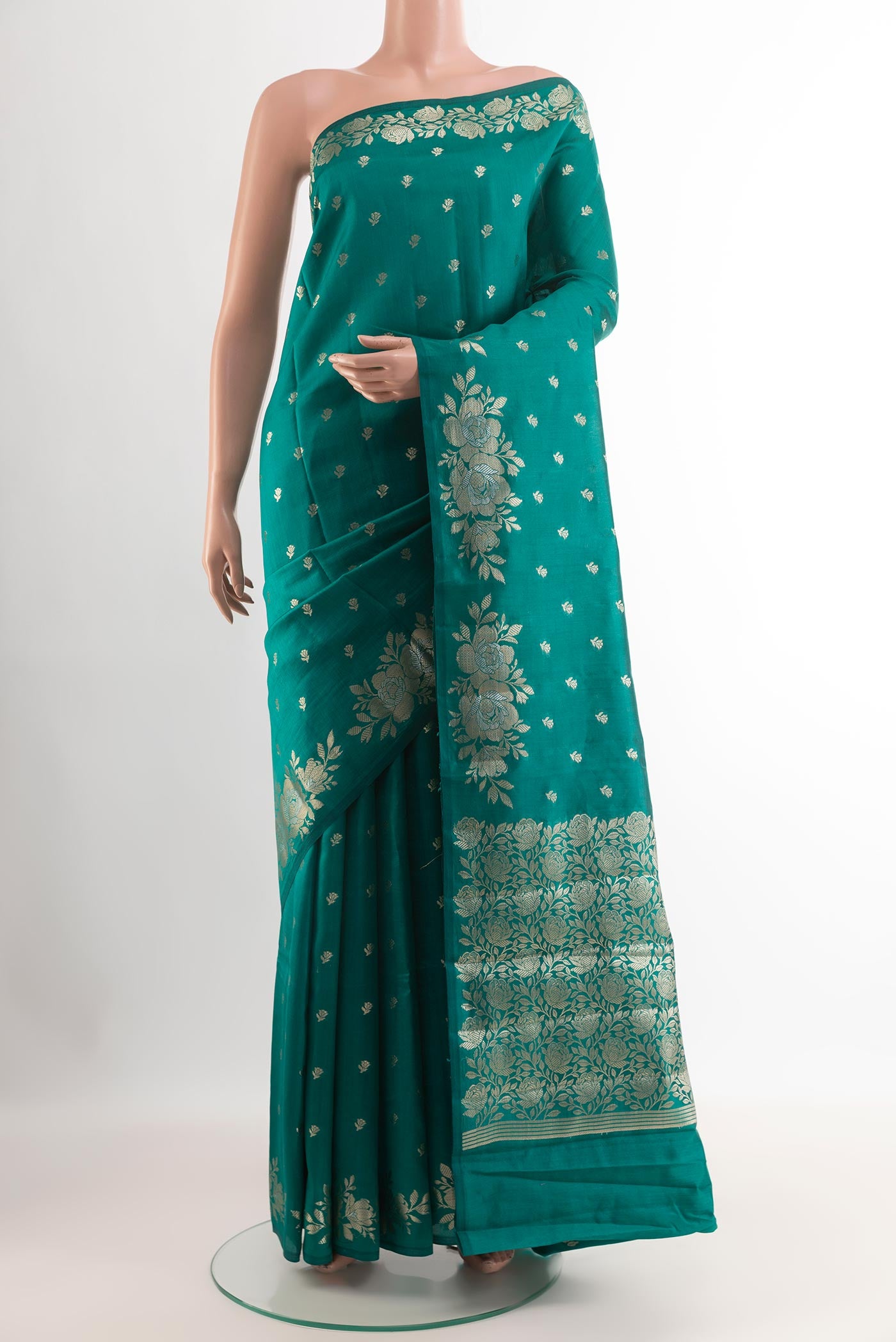 Sea Green Tussar Silk Saree with Zari Butta on the body and Zari Border.  displayed on a mannequin