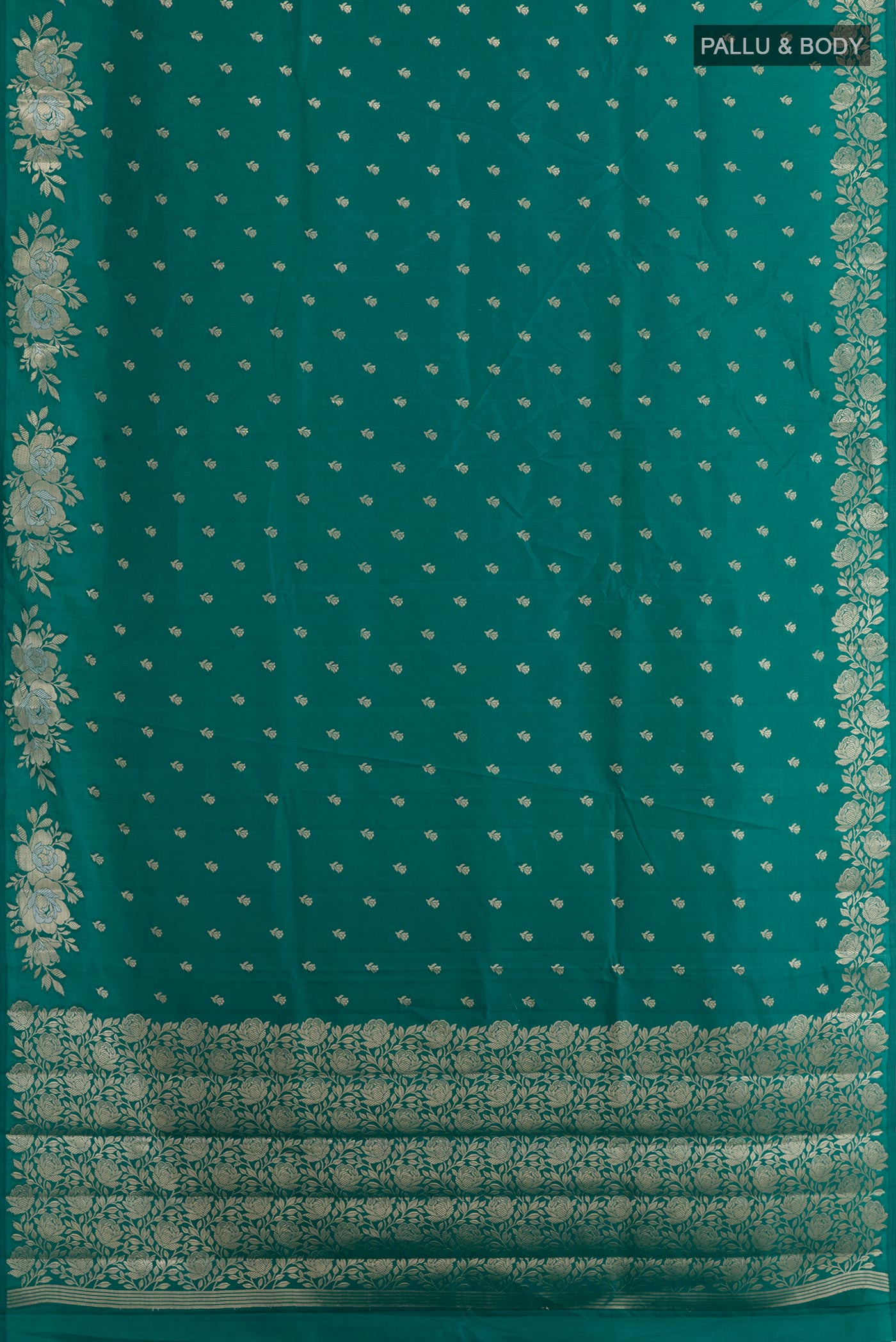 Flat view of Sea Green Tussar Silk Saree with Zari Butta on the body and Zari Border. 
