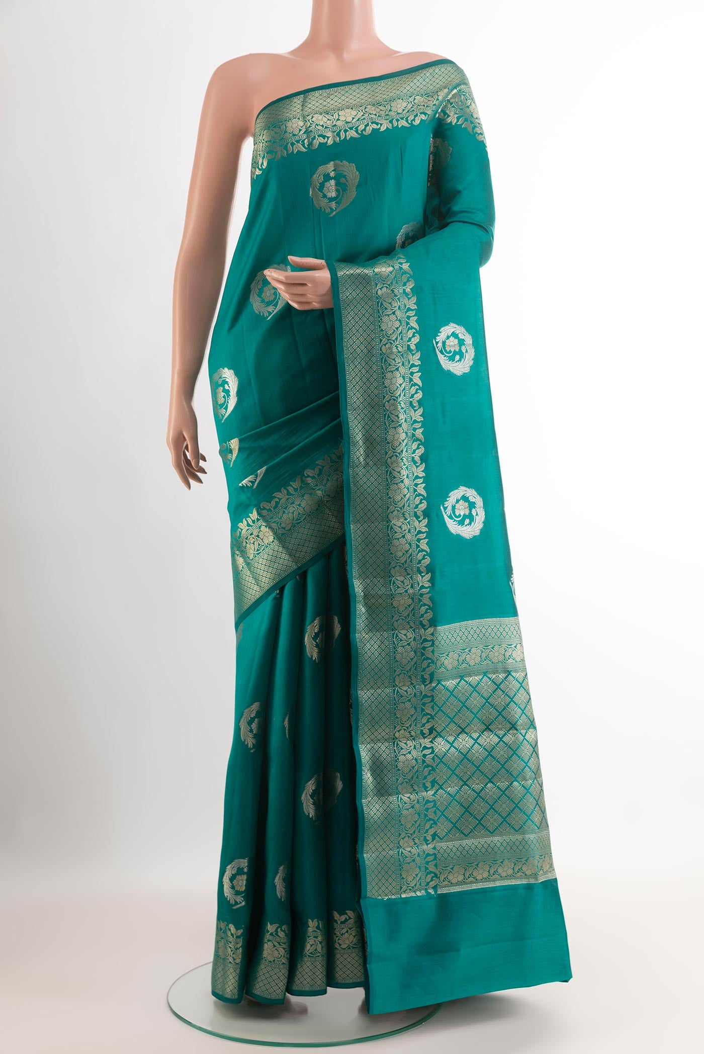 Sea Green Tussar Silk Saree with Zari Butta on the body and Zari Border.  displayed on a mannequin