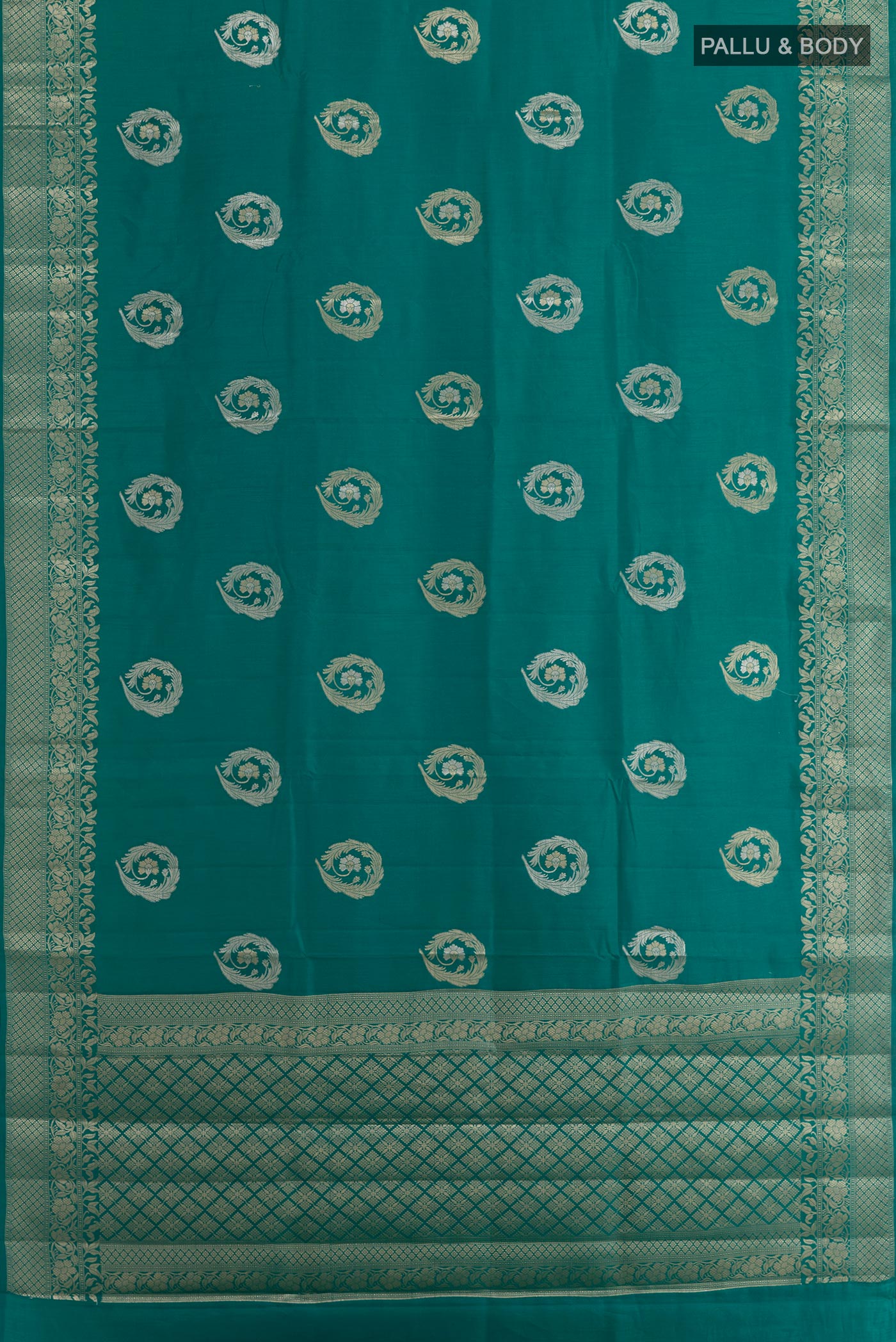 Flat view of Sea Green Tussar Silk Saree with Zari Butta on the body and Zari Border. 