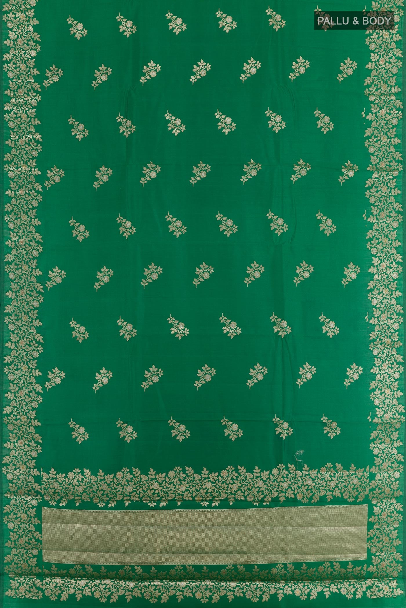 Flat view of Green Tussar Silk Saree with Zari Butta on the body and Zari Border. 