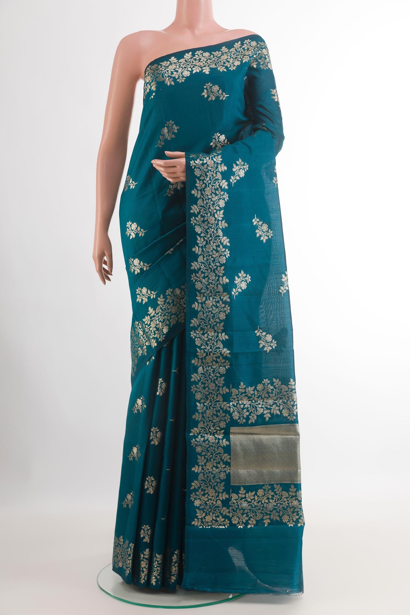 Royal Blue Tussar Silk Saree with Zari Butta on the body and Zari Border.  displayed on a mannequin