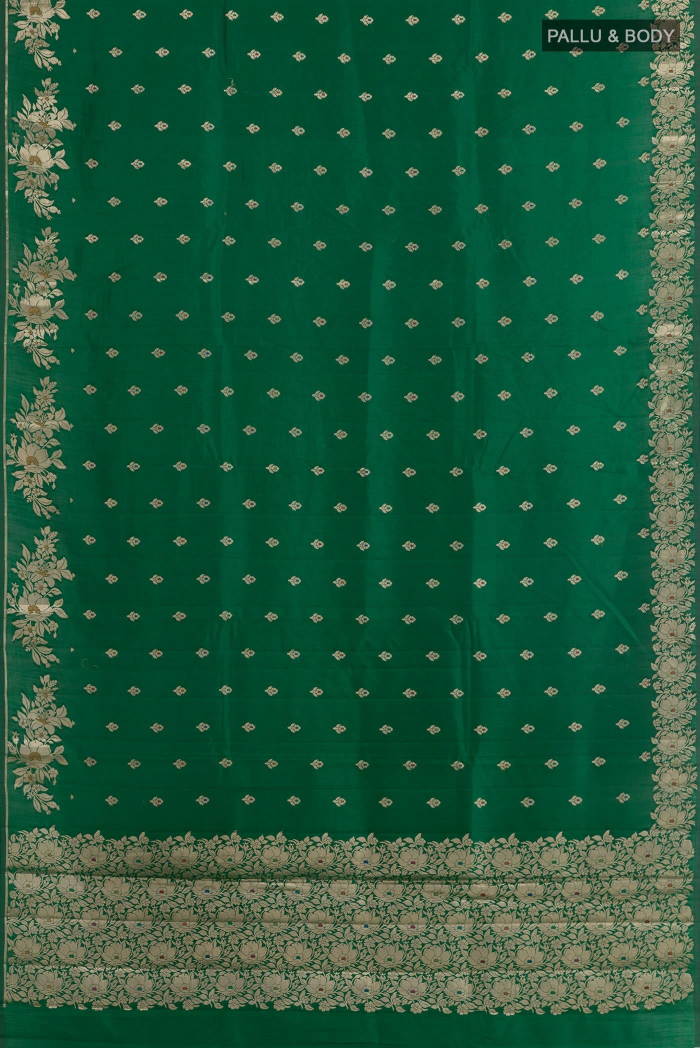 Flat view of Green Tussar Silk Saree with Zari Butta on the body and Zari Border. 