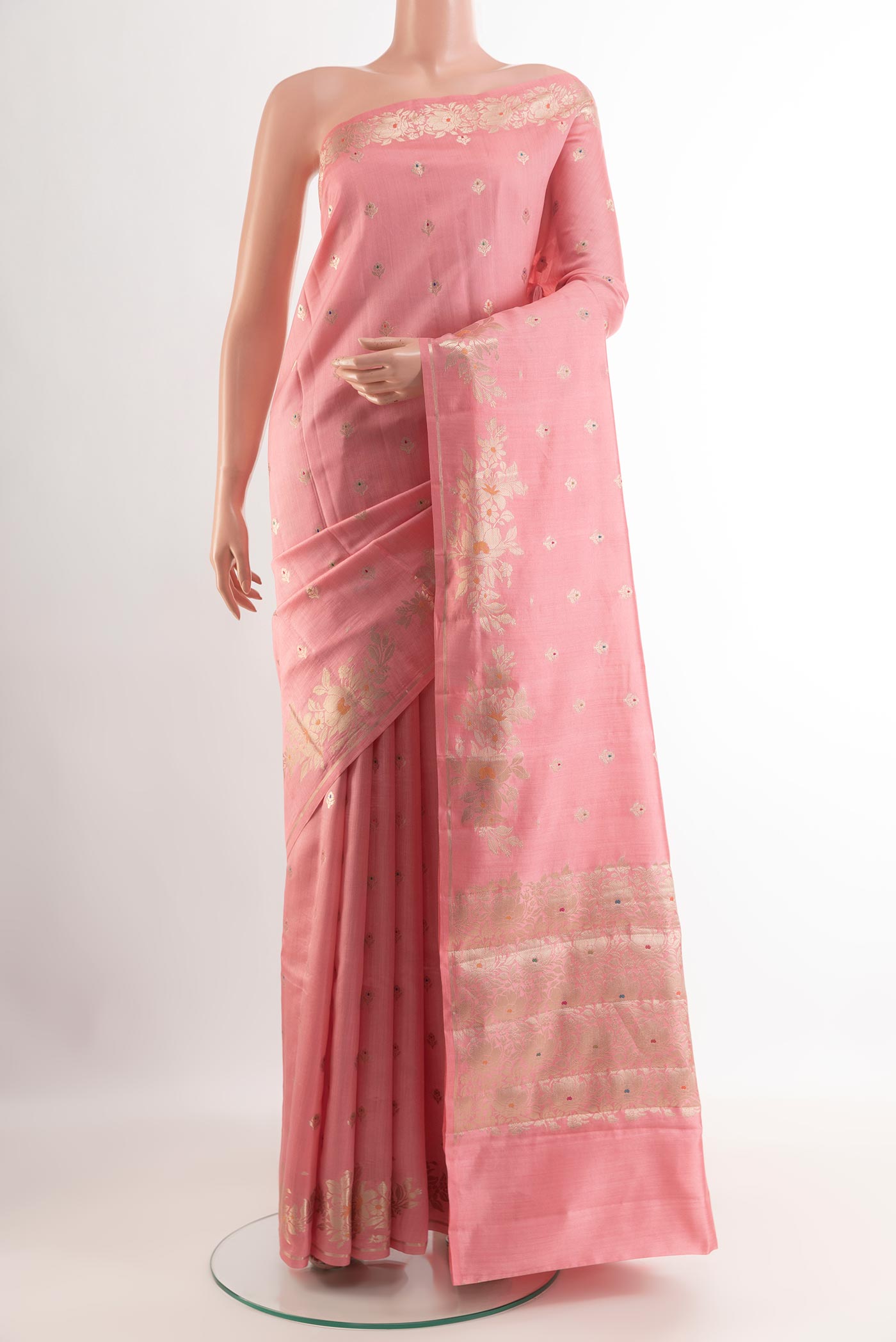 Pink Tussar Silk Saree with Zari Butta on the body and Zari Border.  displayed on a mannequin