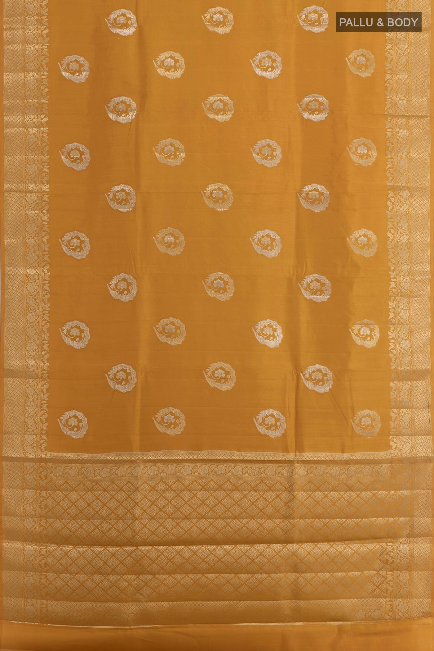 Flat view of Yellow Tussar Silk Saree with Zari Butta on the body and Zari Border. 