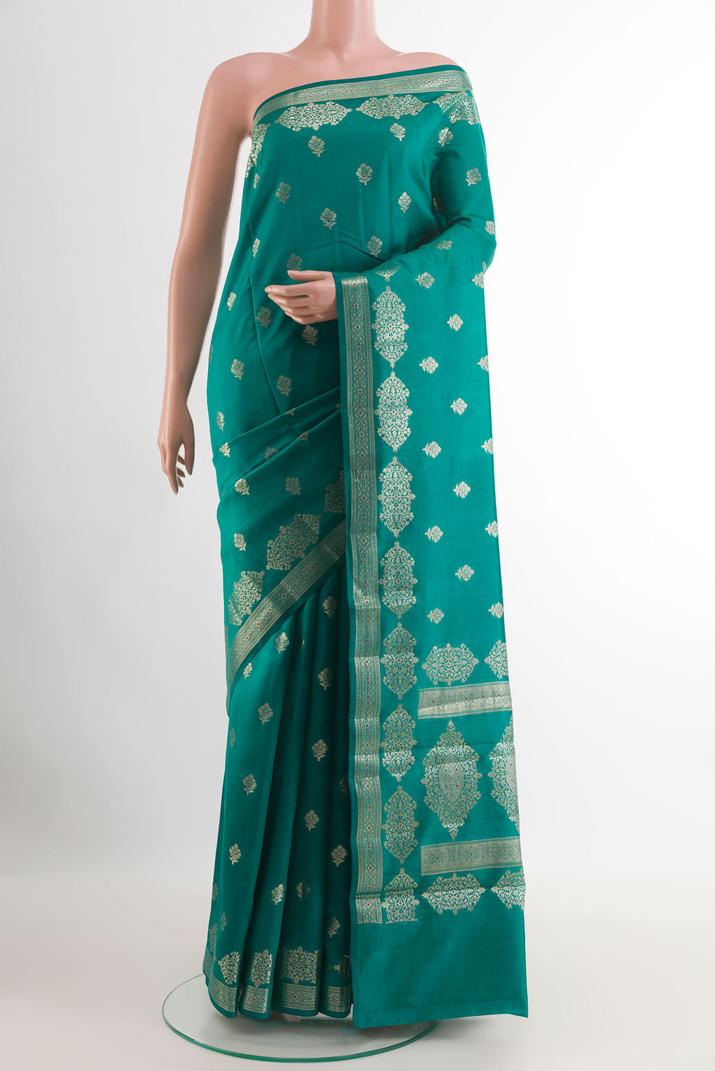 Sea Green Tussar Silk Saree with Zari Butta on the body and Zari Border.  displayed on a mannequin