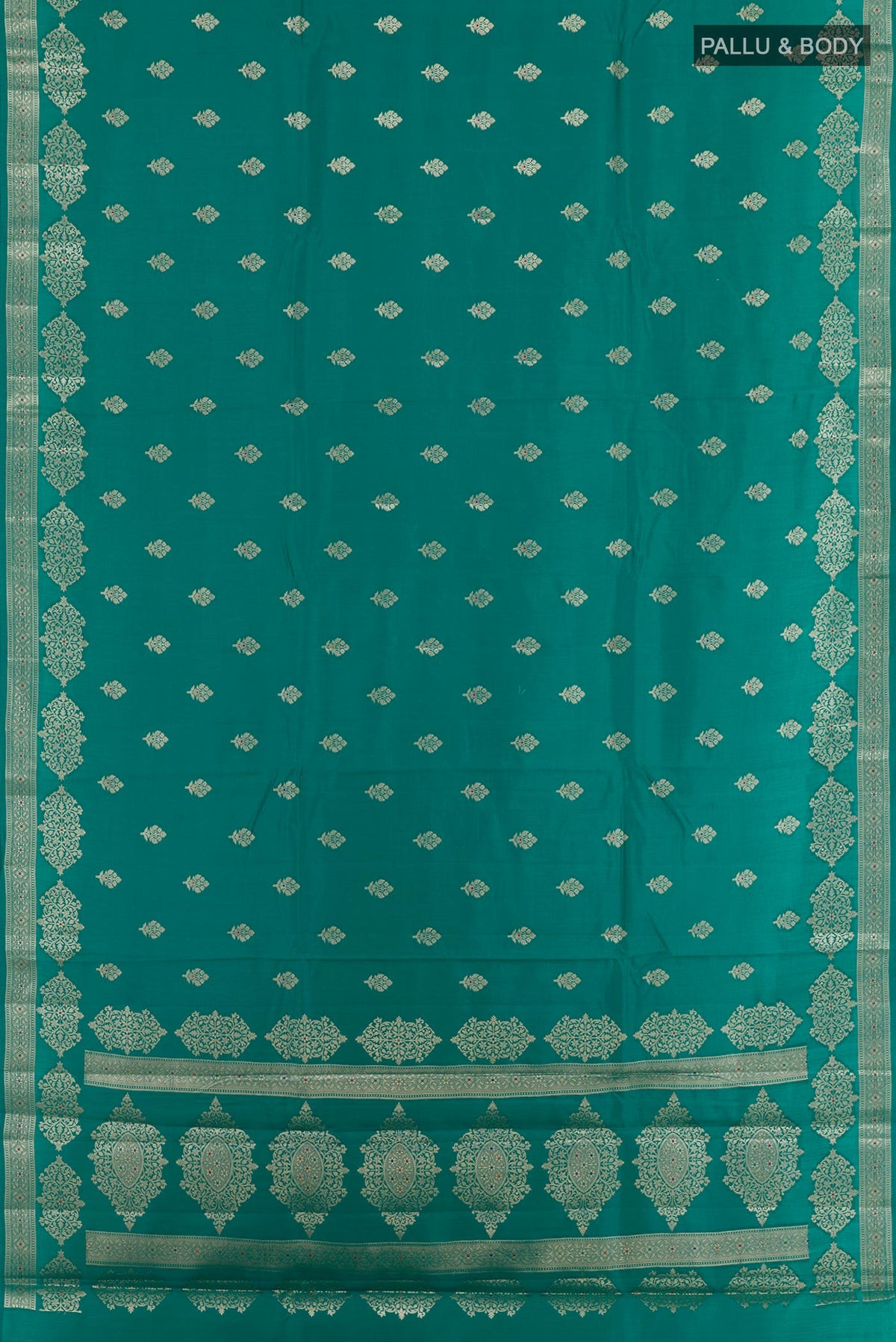 Flat view of Sea Green Tussar Silk Saree with Zari Butta on the body and Zari Border. 