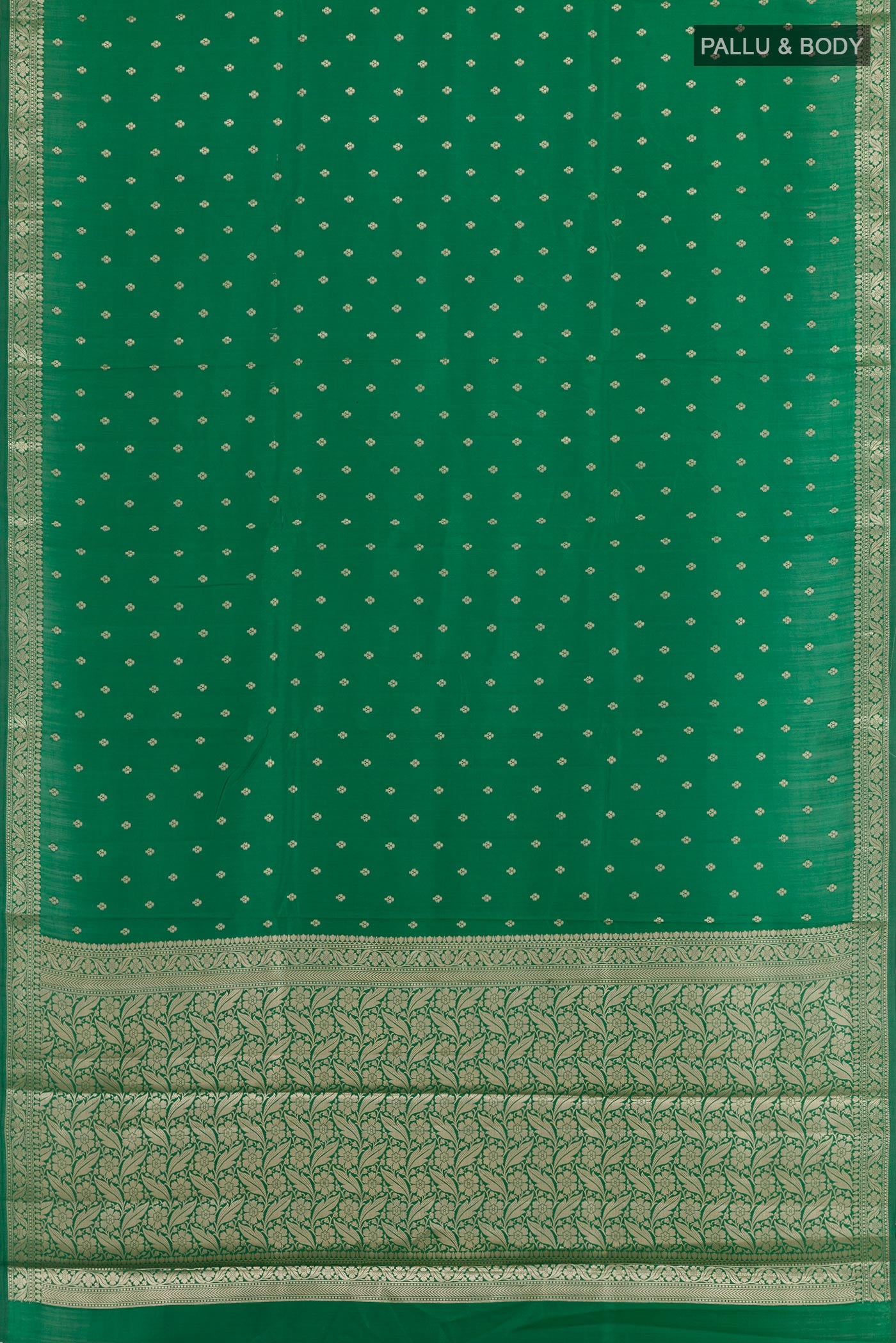 Flat view of Green Tussar Silk Saree with Zari Butta on the body and Zari Border. 