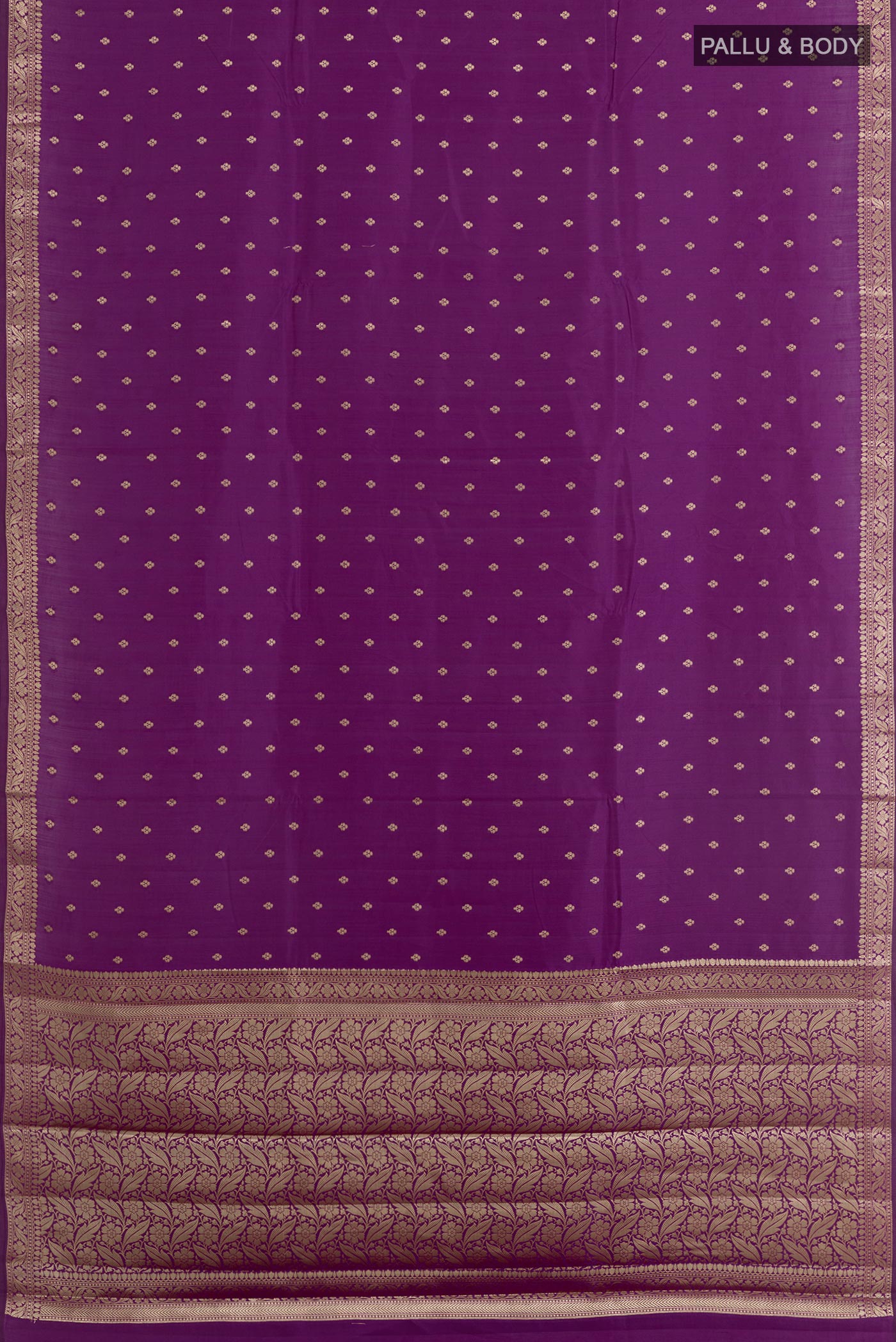 Flat view of Purple Tussar Silk Saree with Zari Butta on the body and Zari Border. 