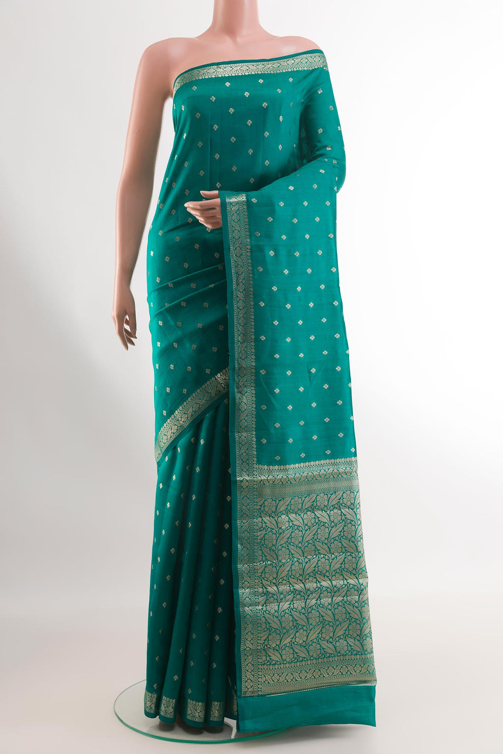Sea Green Tussar Silk Saree with Zari Butta on the body and Zari Border.  displayed on a mannequin