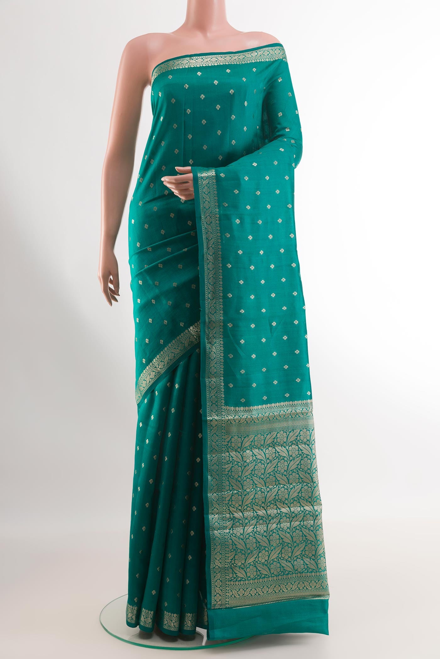 Sea Green Tussar Silk Saree with Zari Butta on the body and Zari Border.  displayed on a mannequin