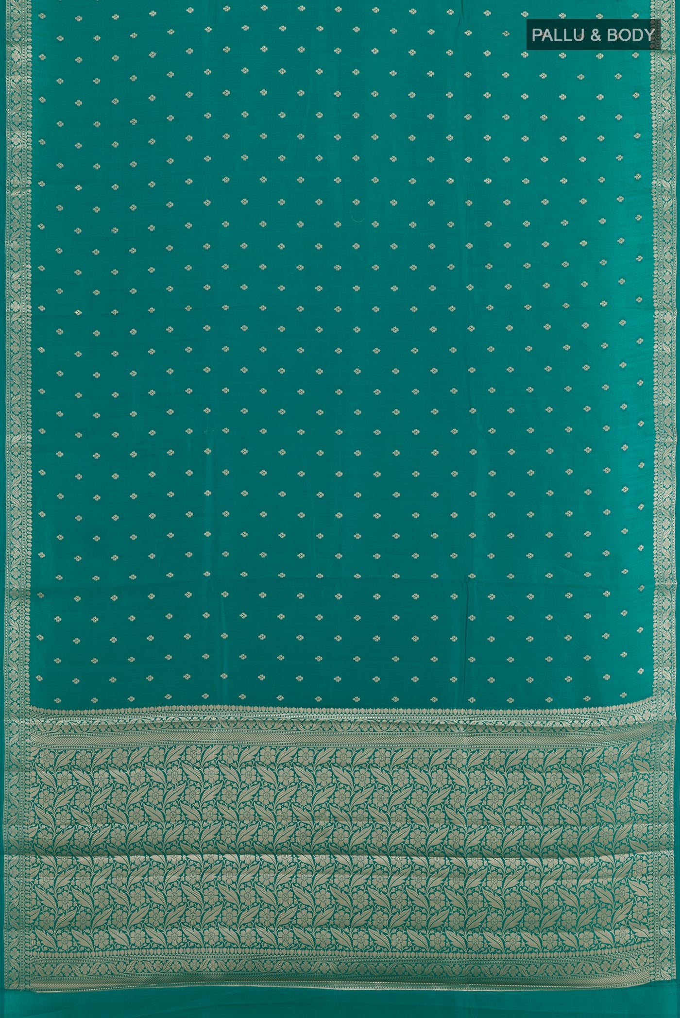 Flat view of Sea Green Tussar Silk Saree with Zari Butta on the body and Zari Border. 