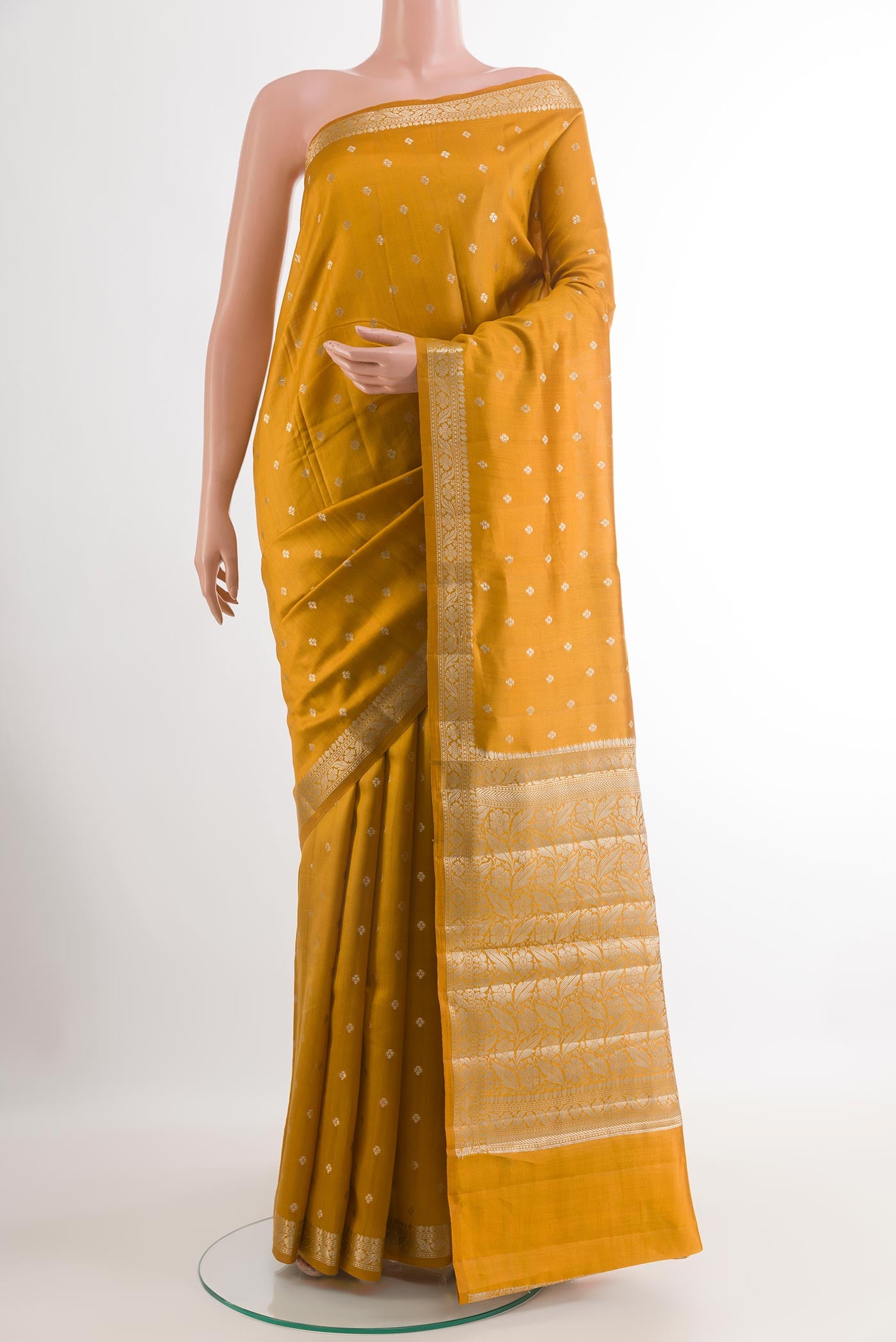 Yellow Tussar Silk Saree with Zari Butta on the body and Zari Border.  displayed on a mannequin