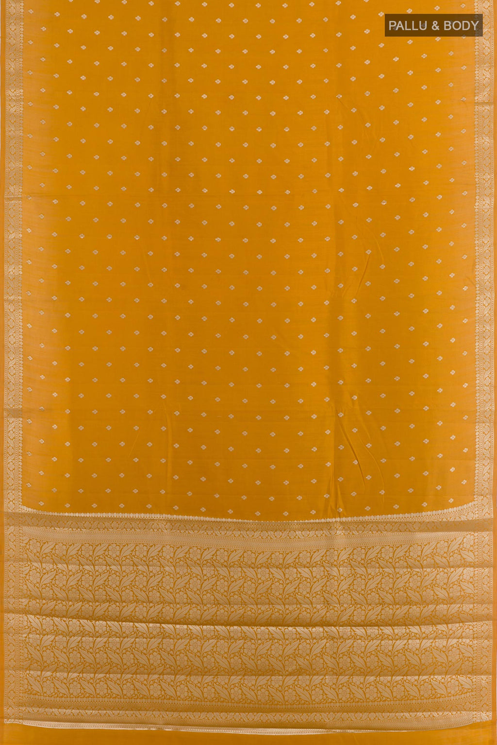 Flat view of Yellow Tussar Silk Saree with Zari Butta on the body and Zari Border. 
