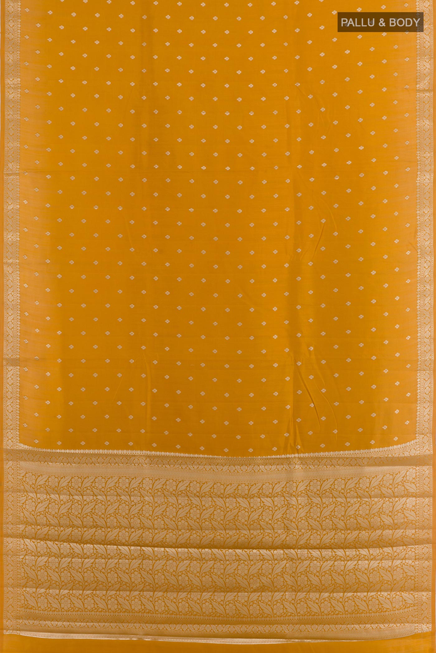 Flat view of Yellow Tussar Silk Saree with Zari Butta on the body and Zari Border. 