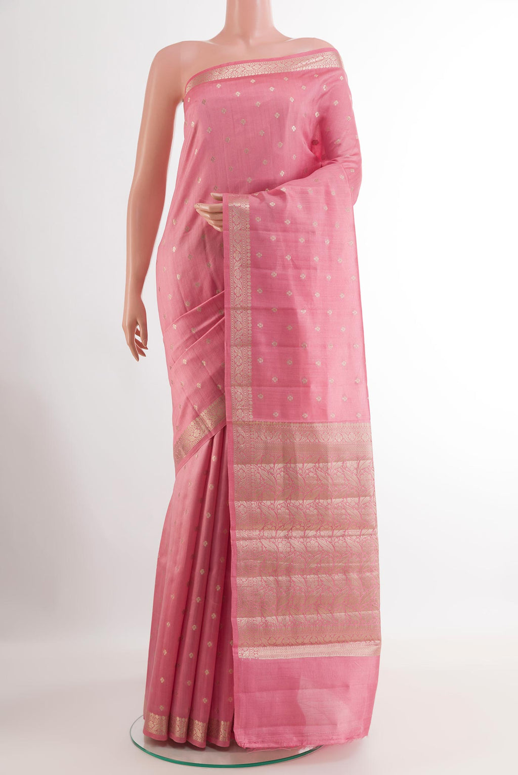 Pink Tussar Silk Saree with Zari Butta on the body and Zari Border.  displayed on a mannequin