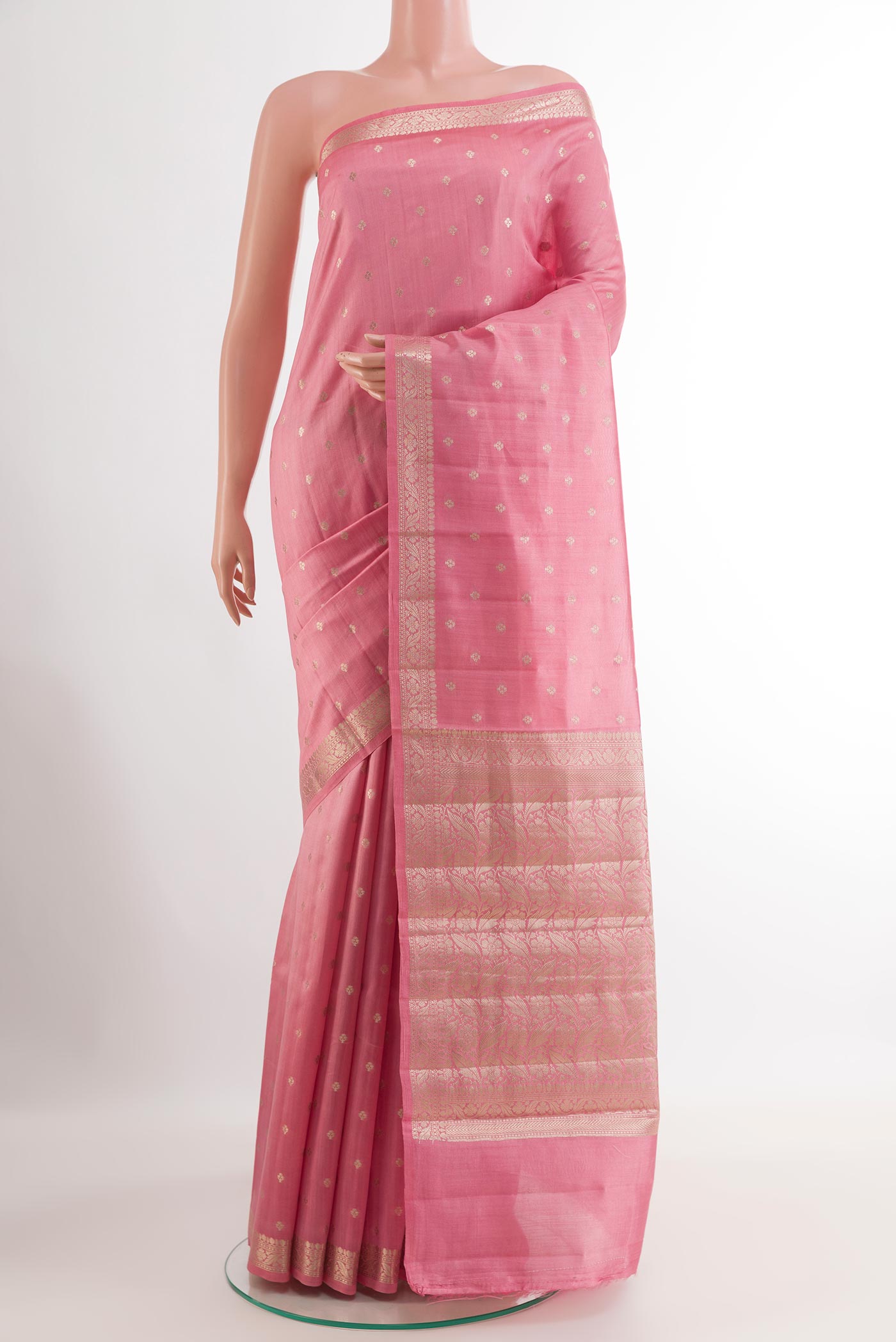 Pink Tussar Silk Saree with Zari Butta on the body and Zari Border.  displayed on a mannequin