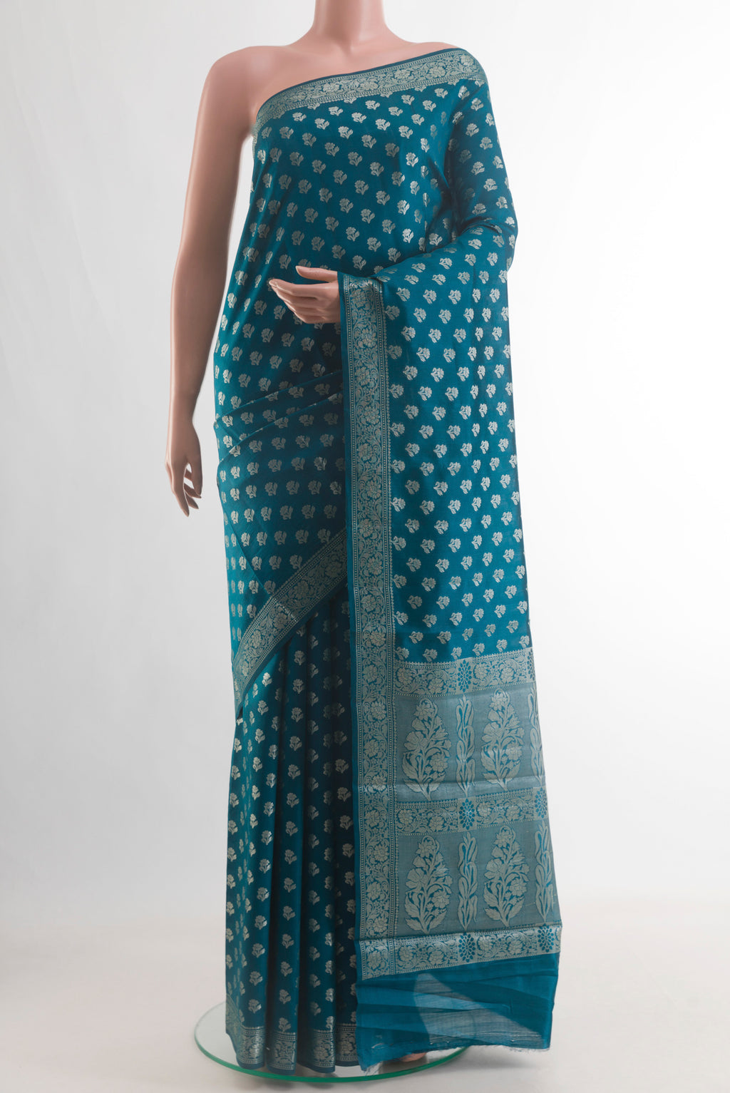 Blue Tussar Silk Saree with Zari Butta on the body and Zari Border.  displayed on a mannequin