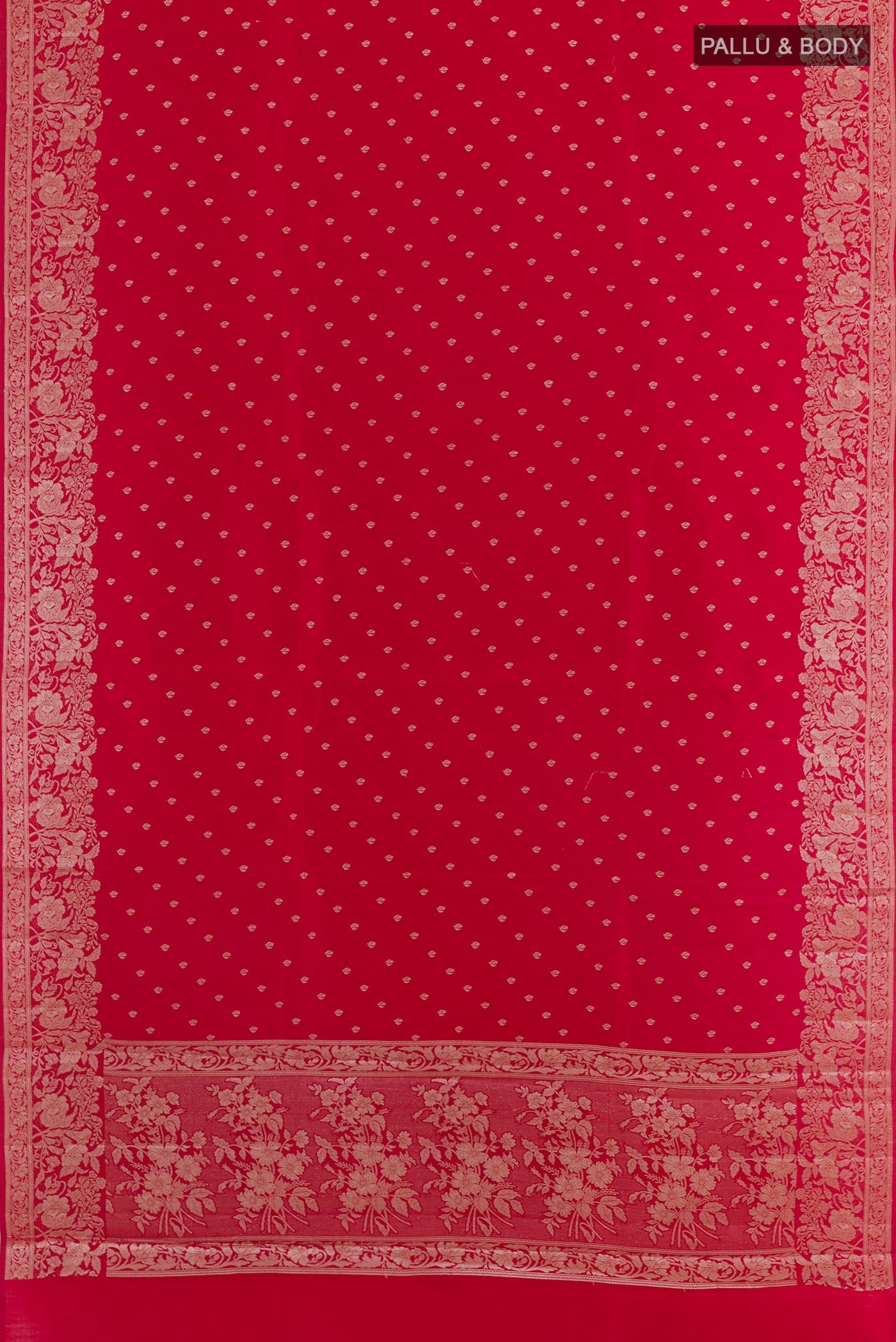 Flat view of Red Tussar Silk Saree with Zari Butta on the body and Zari Border. 