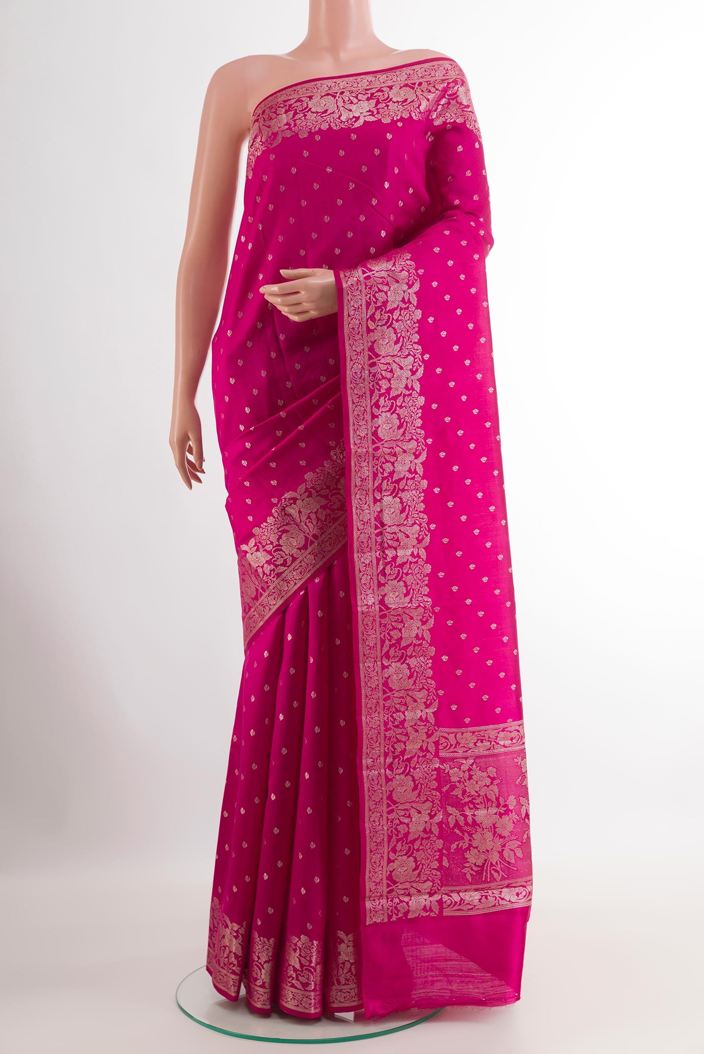 Pink Tussar Silk Saree with Zari Butta on the body and Zari Border.  displayed on a mannequin